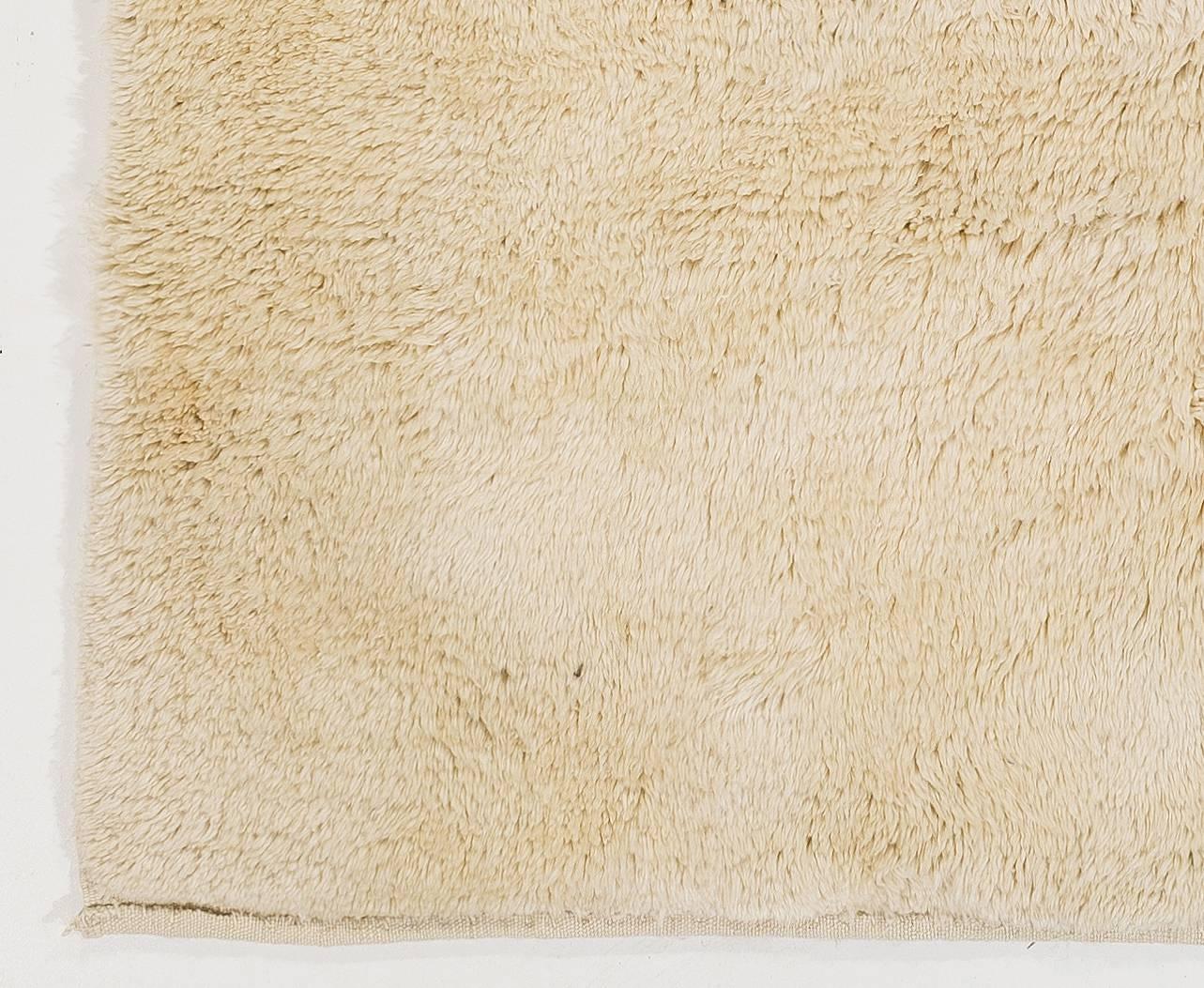 A contemporary handmade Tulu (Turkish word for thick soft pile) rug made of fine natural un-dyed, hand-spun sheep wool.

The rug can be custom produced in a different size, color combination, any pattern and weave any design in approximately 5 weeks.
