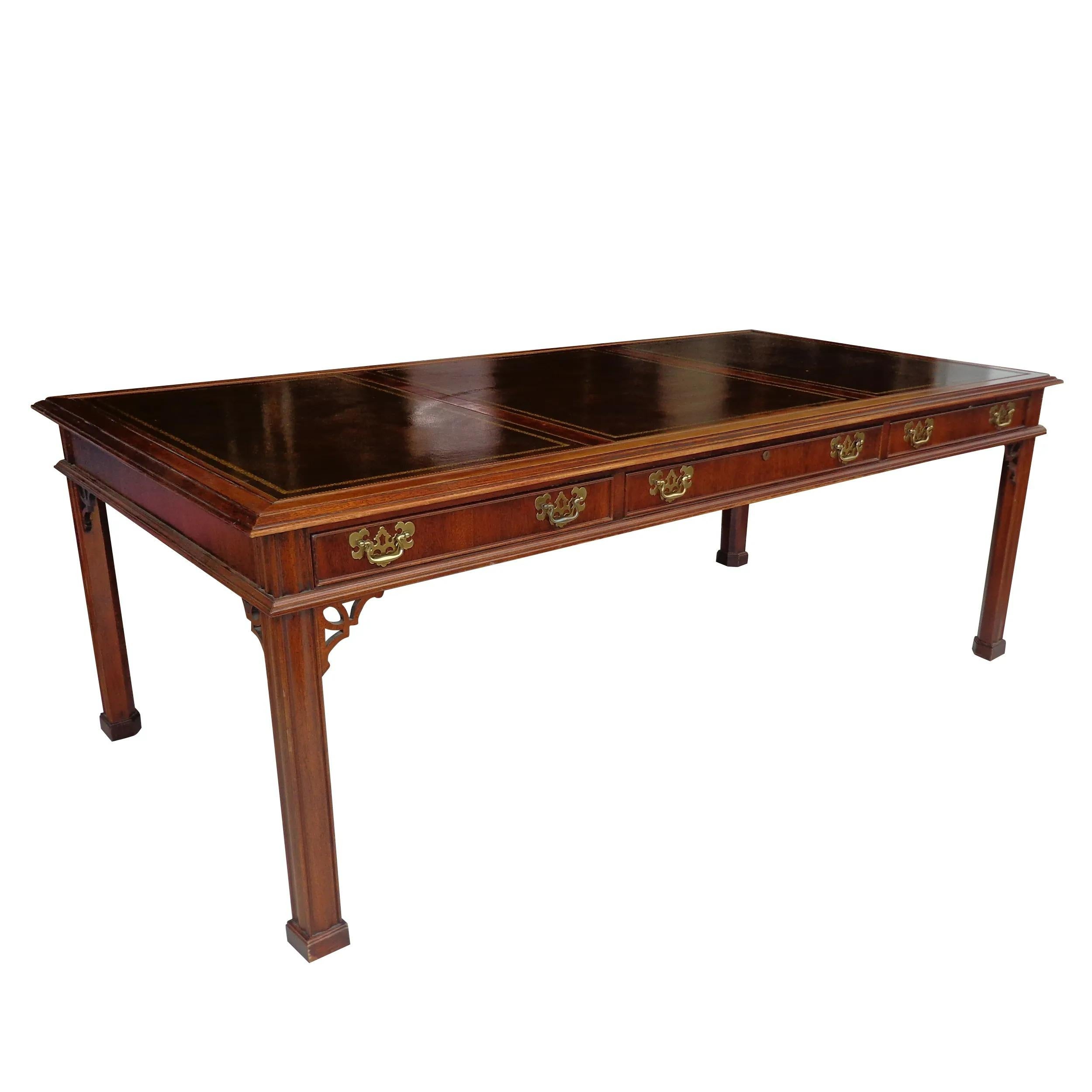 84? Banded Chippendale Regency sligh furniture writing desk

Traditional mahogany writing desk inspired by Chippendale desks from the Regency period with Classic straight legs. 2 drawer with compartments. Banded top with tooled leather insets.  We