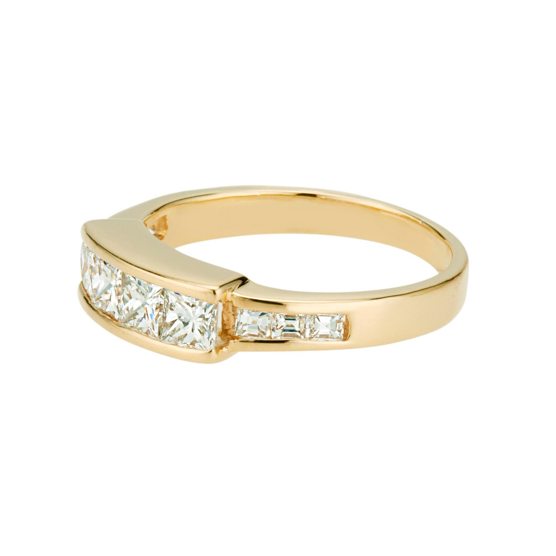Diamond wedding band. 4 princess cut channel set diamonds in a 20k yellow gold setting with 6 step cut square accent diamonds. Circa 1970's

4 princess cut diamonds, G-H VS approx. .60cts
6 step cut square diamonds, G-H VS approx. .24cts
Size 5.25