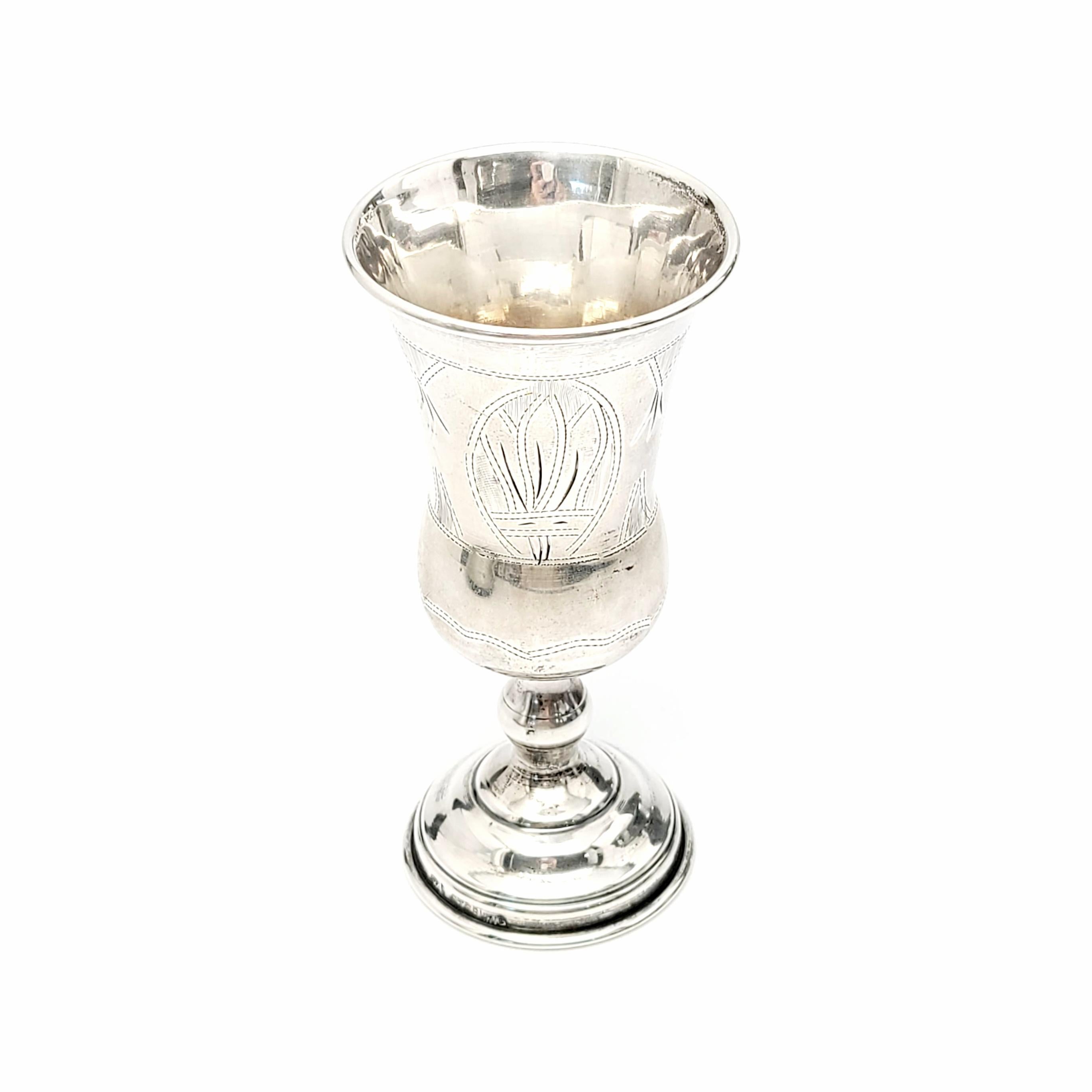 Vintage sterling silver vodka or Kiddush cup.

Beautiful bright cut etched design on 3 panels around the cup. Panels alternate between floral wheat-like designs and a Star of David and engraving. Engraving appears to be M.Y. and J.P.Y