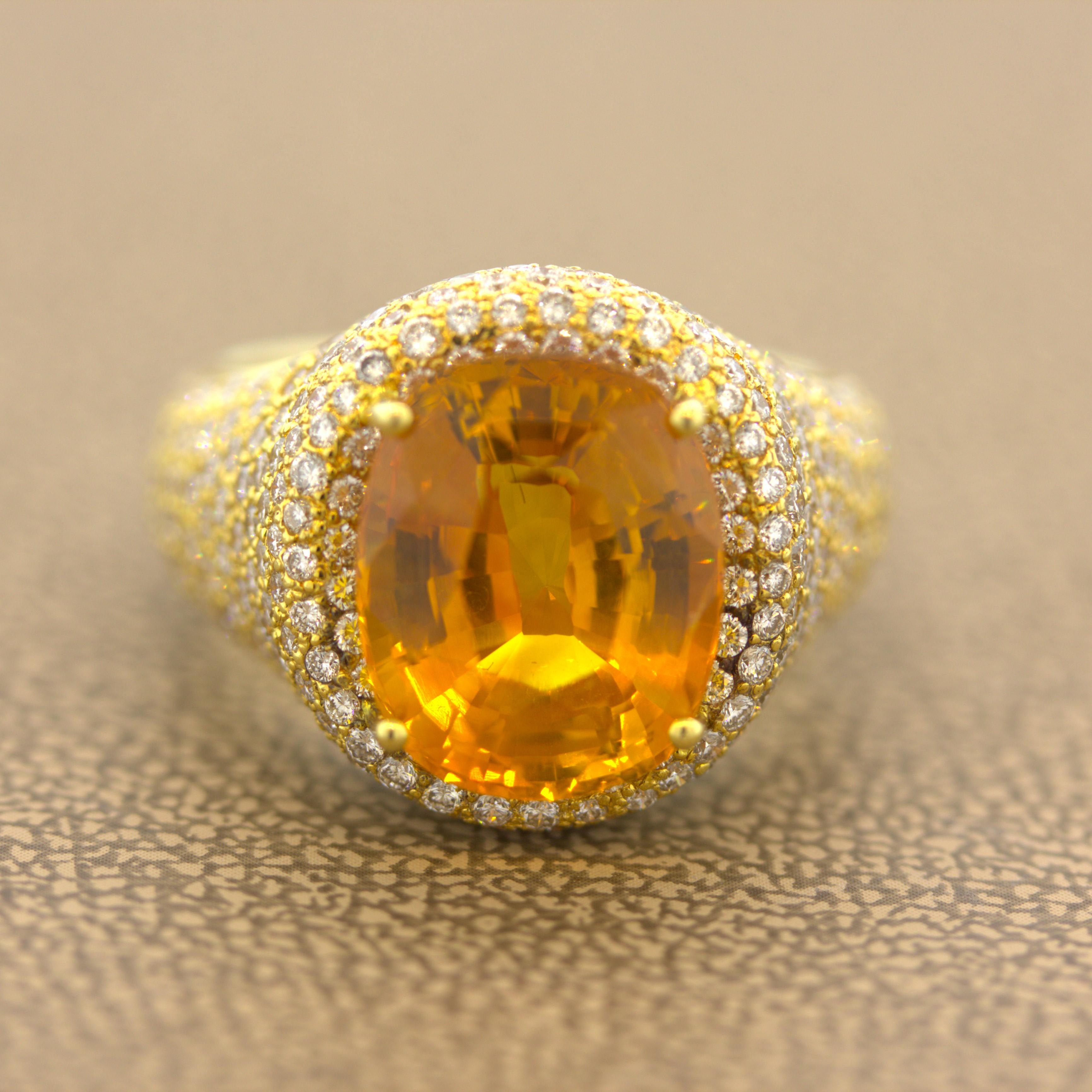 A lovely gem quality orange sapphire takes center stage! It weighs an impressive 8.40 carats and has a vibrant brilliant orange color with no visible inclusions. It is complemented by 4.22 carats of round brilliant pave-set diamonds set around the