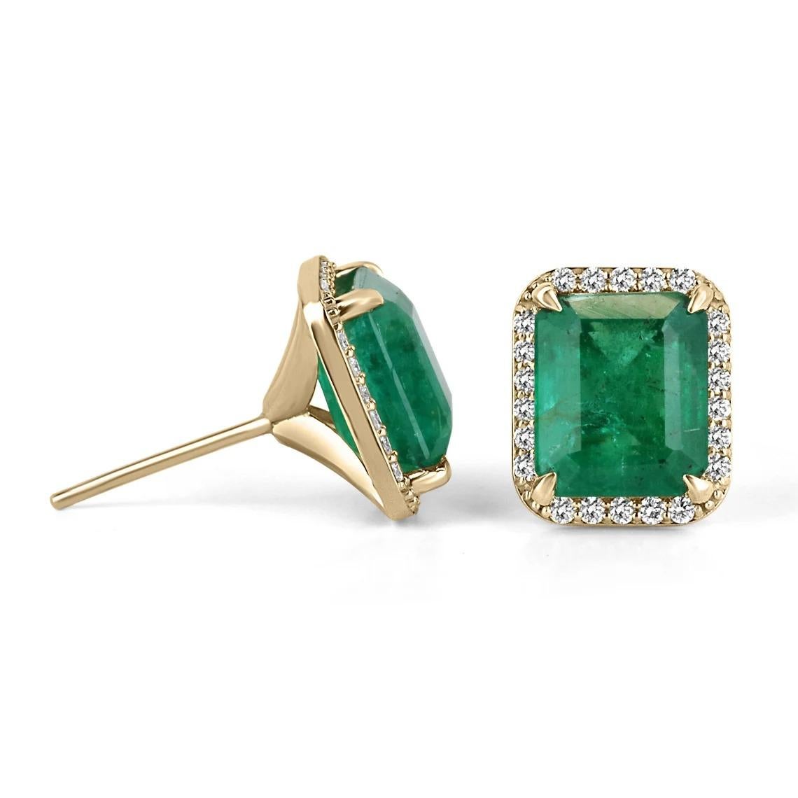 These natural emerald and diamond earrings are a stunning piece of jewelry. The emeralds, with a combined carat weight of 7.90, are the main gemstones and display a lush dark green color with good clarity and luster. They are surrounded by a halo of