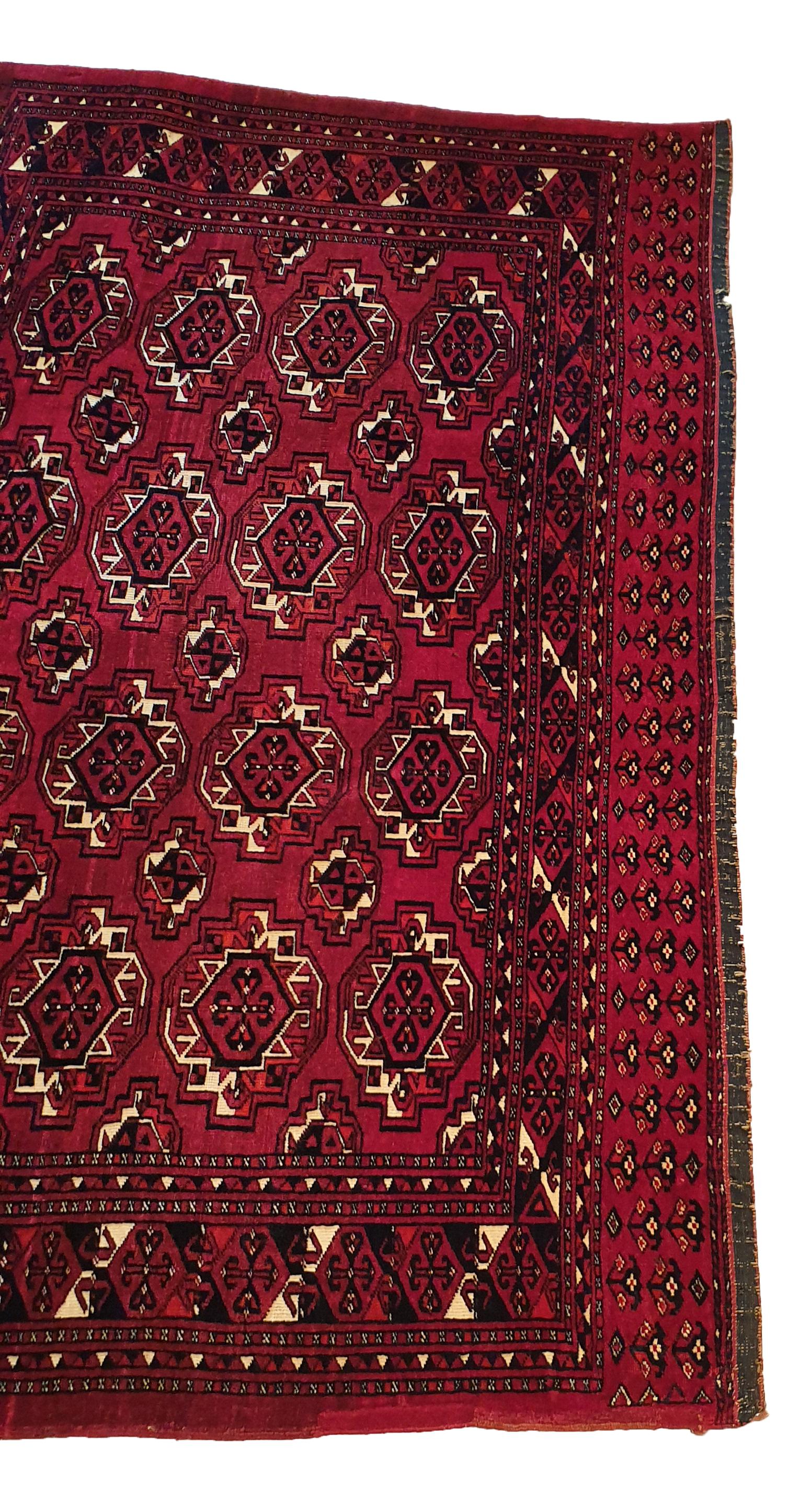 841 - Beautiful late 19th century Turkmen for horse or Chuval cover, with a nice Bukhara design and natural red field colors, finely hand-knotted with wool velvet on wool foundation.