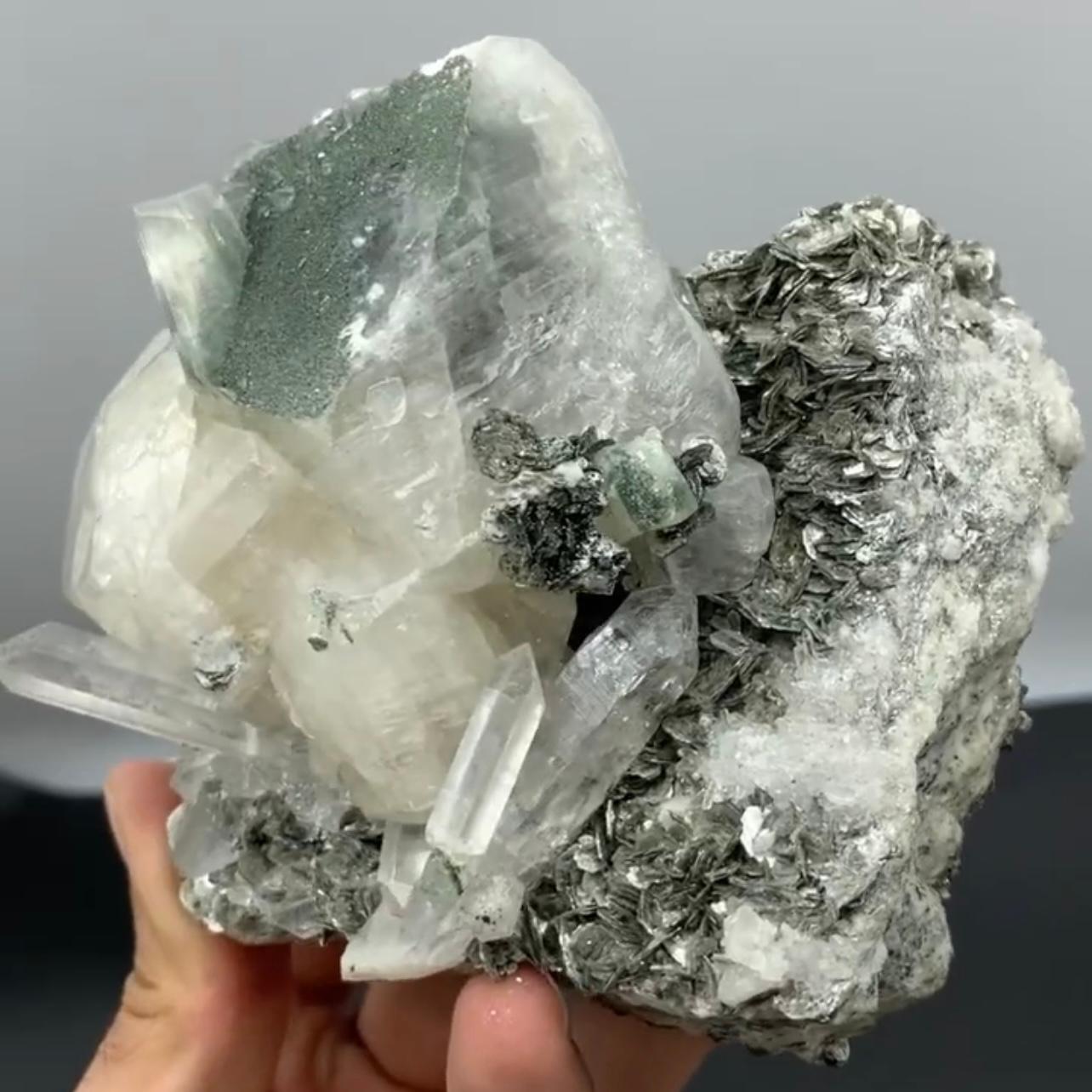 Product Information:

Specimen Name: Calcite with Quartz on Mica

Weight: 842 grams

Dimensions: H: 9.5 x W: 10 x D: 7 cm

Treatment: None

Origin: Skardu District, Gilgit Baltistan Province,
Pakistan

Description:

The isometric focal crystal of