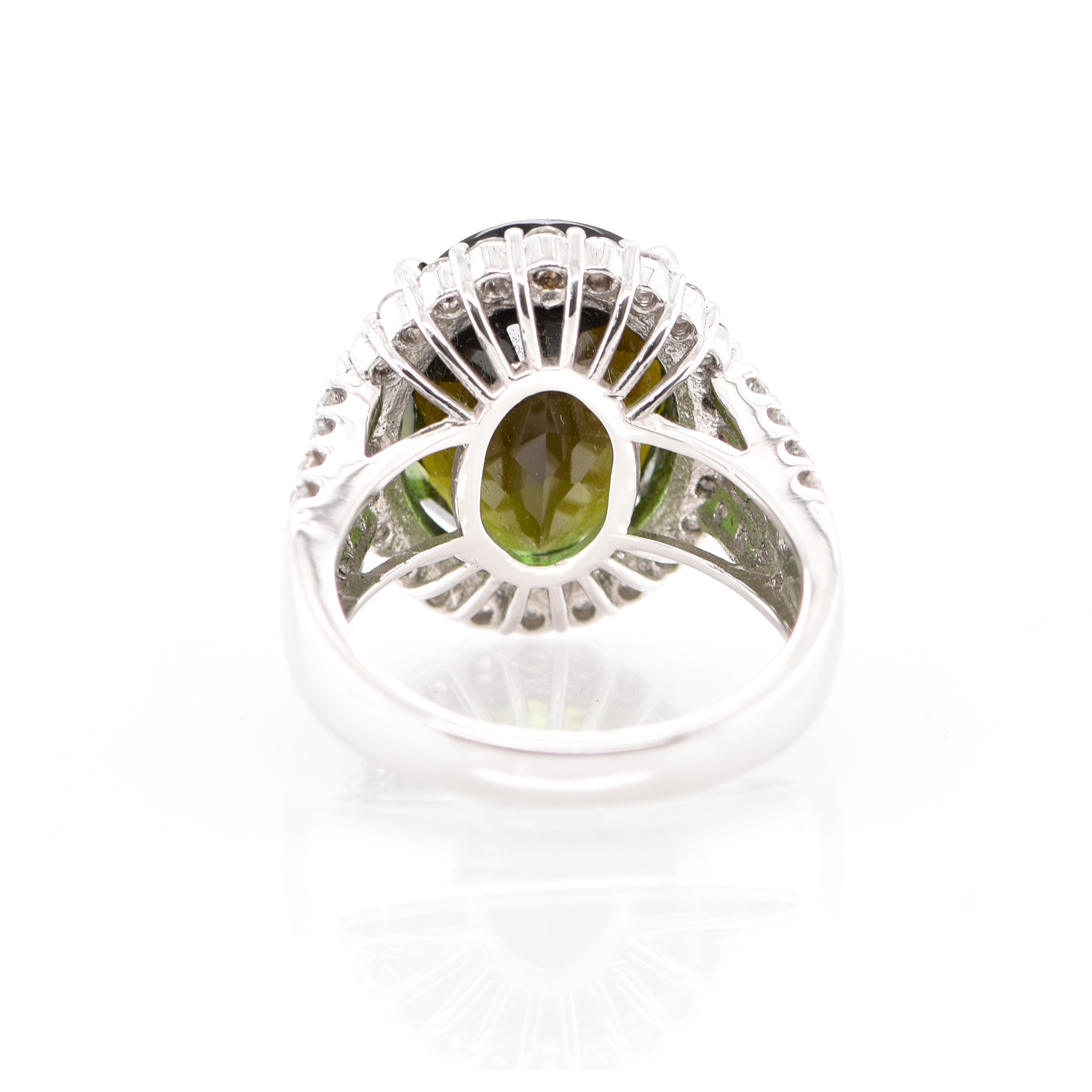 A stunning Cocktail Ring featuring a 8.43 Carat Green Tourmaline and 1.22 Carats of Diamond Accents set in Platinum. Tourmalines were first discovered by Spanish conquistadors in Brazil in 1500s. The name Tourmaline comes from Sinhalese meaning: