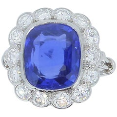 8.43 Carat Unheated Ceylon Sapphire Diamond and Platinum Cluster Ring