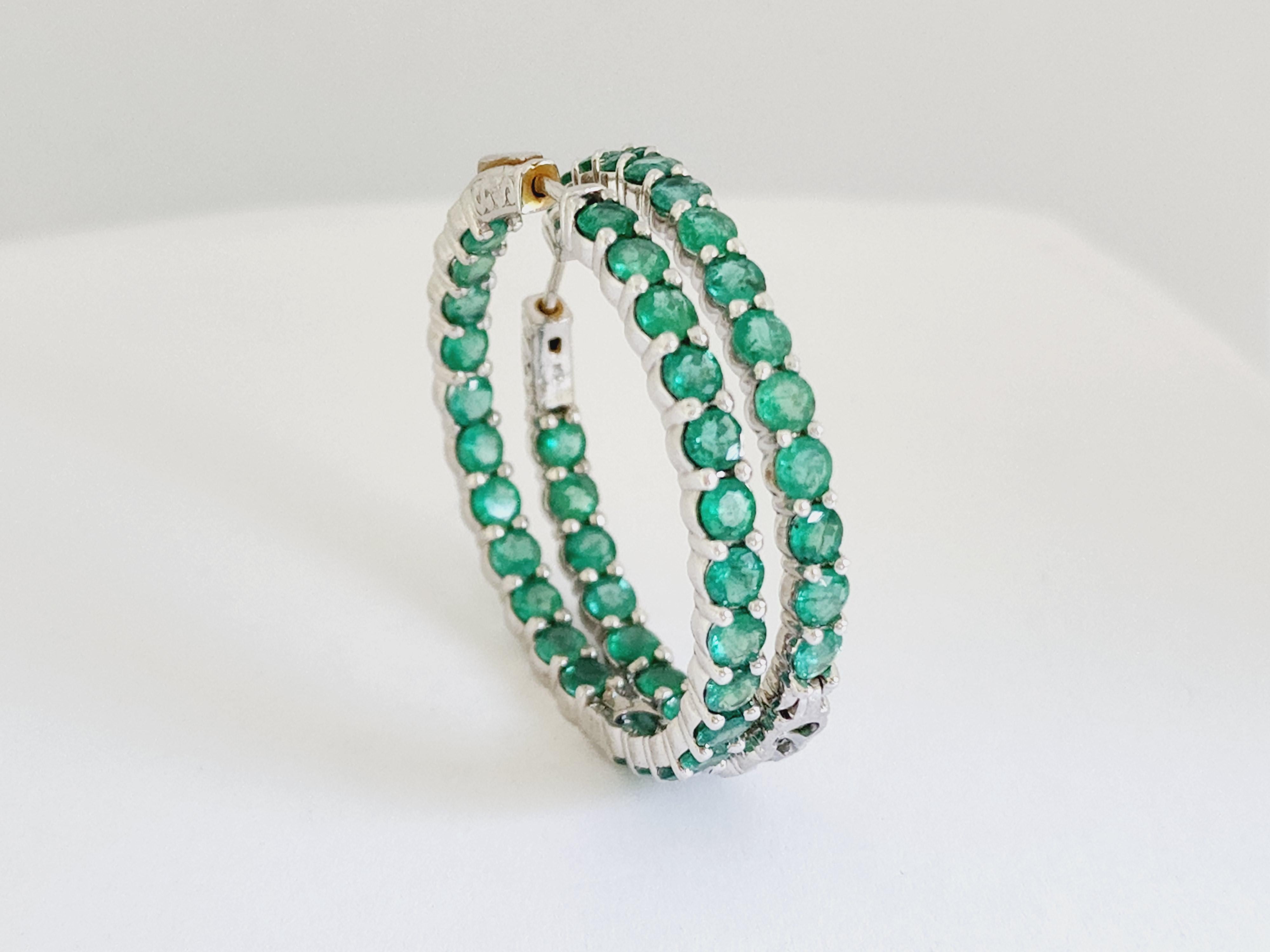 Beautiful pair of Emerald inside out hoop earrings in 14k white gold. Secures with push snap closure. Perfect for the everyday wear! Measures 1.50 inch diameter.