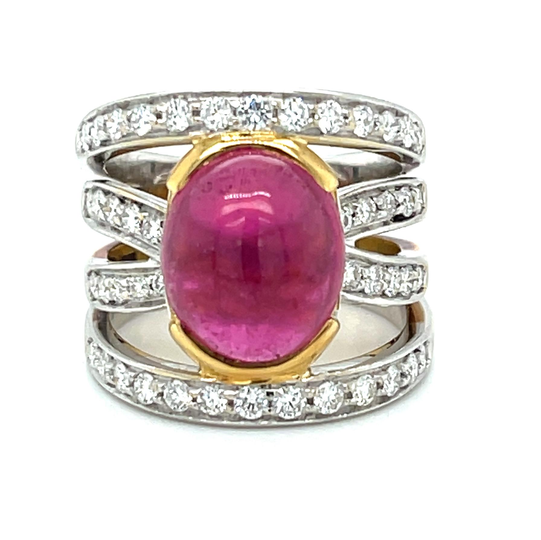 This fuchsia-pink tourmaline cabochon is nature's own confection, bezel set in a gorgeous 18k gold band ring. The diamond-studded crisscross band combines a blend of both white and yellow 18k gold, making this ring both stylish and sophisticated. A