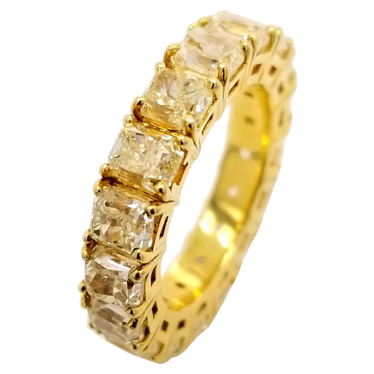 8.45 Carat Share Prong Fancy Yellow Radiant Diamond 18 Karat Gold Eternity Ring For Sale
