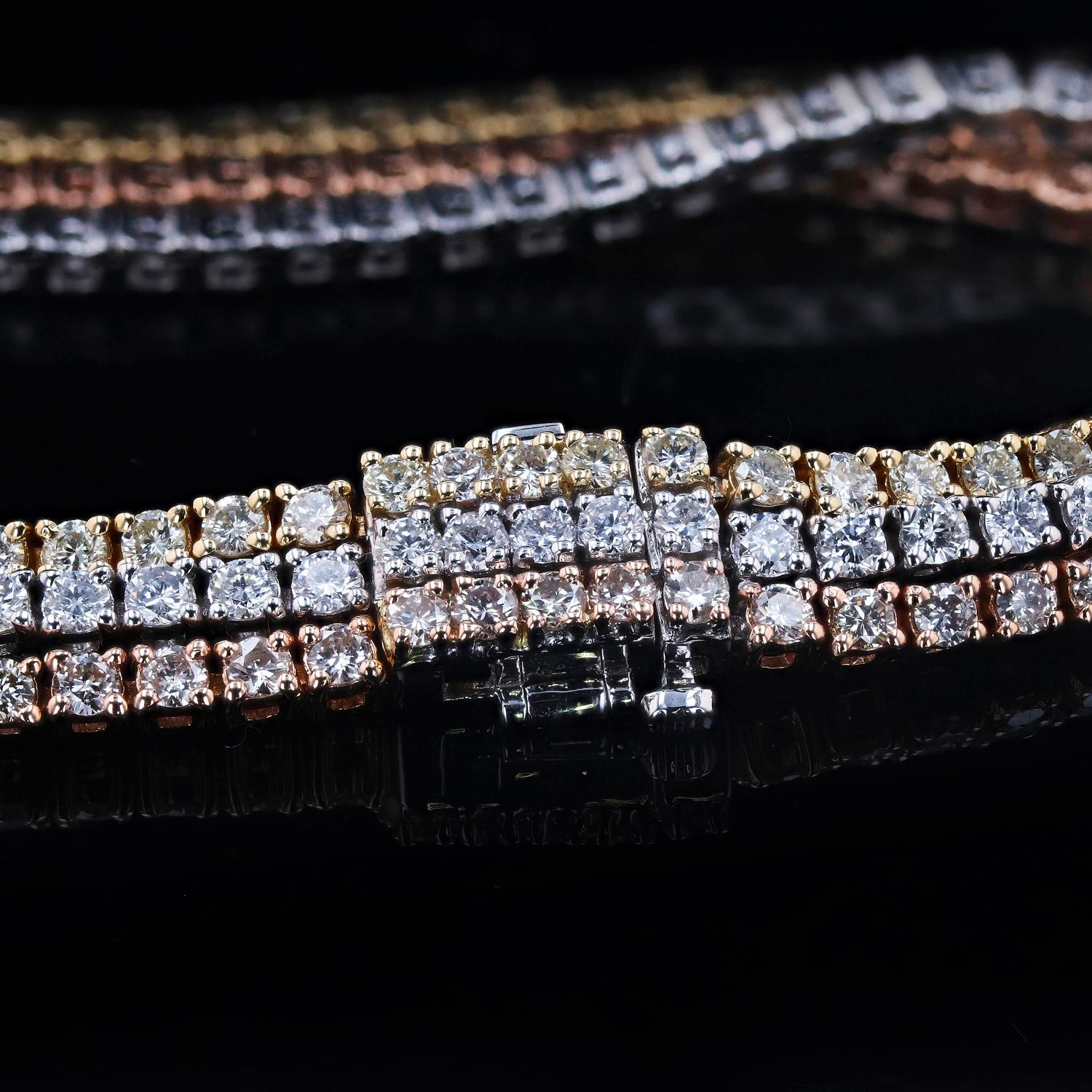 14K Gold Diamond Bracelet 
One polished, and tested, 14 karat yellow, rose, and white gold bracelet mounted with 189 genuine round diamonds weighing approximately 8.45 carats. The bracelet measures 7 inches in length and is finished with a tension