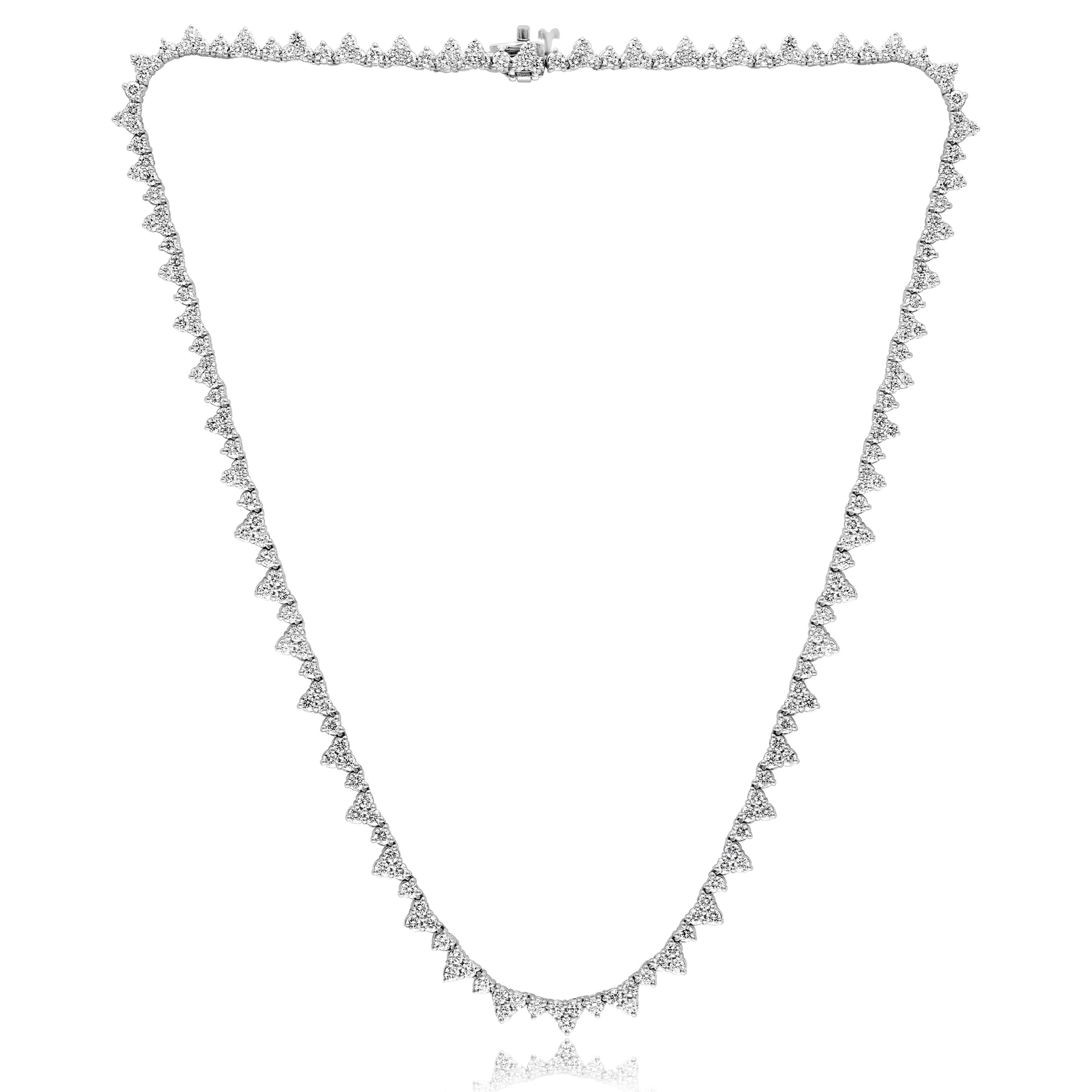 A brilliant and classic piece showcasing a line of round diamonds set as triangles in 14K White Gold. 220 diamonds in this necklace are brilliant round cut and weigh 8.46 carats in total. 16 inches in length.