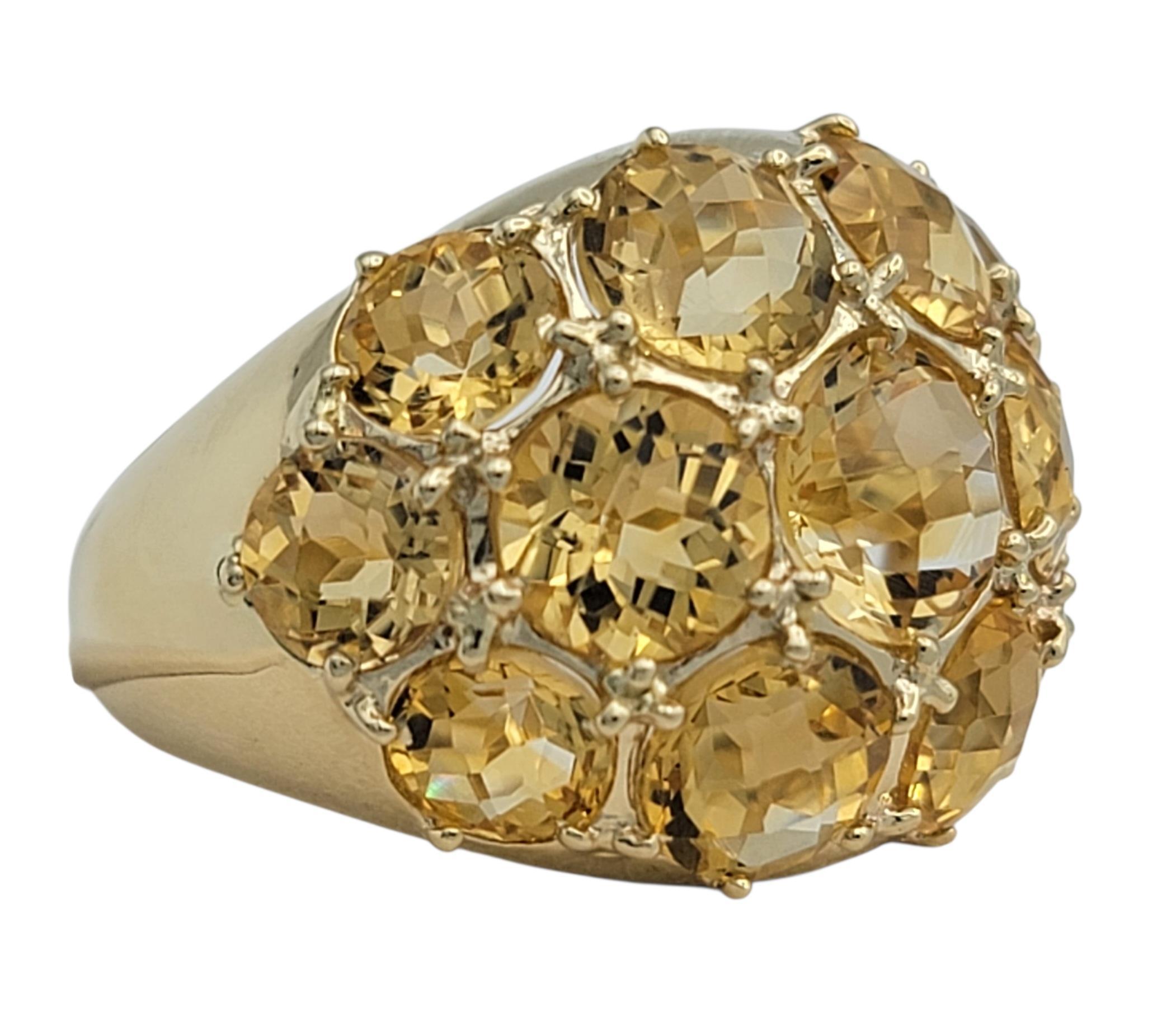 This striking citrine ring dazzles with a brilliant mosaic of golden hues that radiate warmth from every angle. The center stone glows like captured sunlight, enriched by a lively checkered pattern that enhances its natural sparkle. Surrounding it,