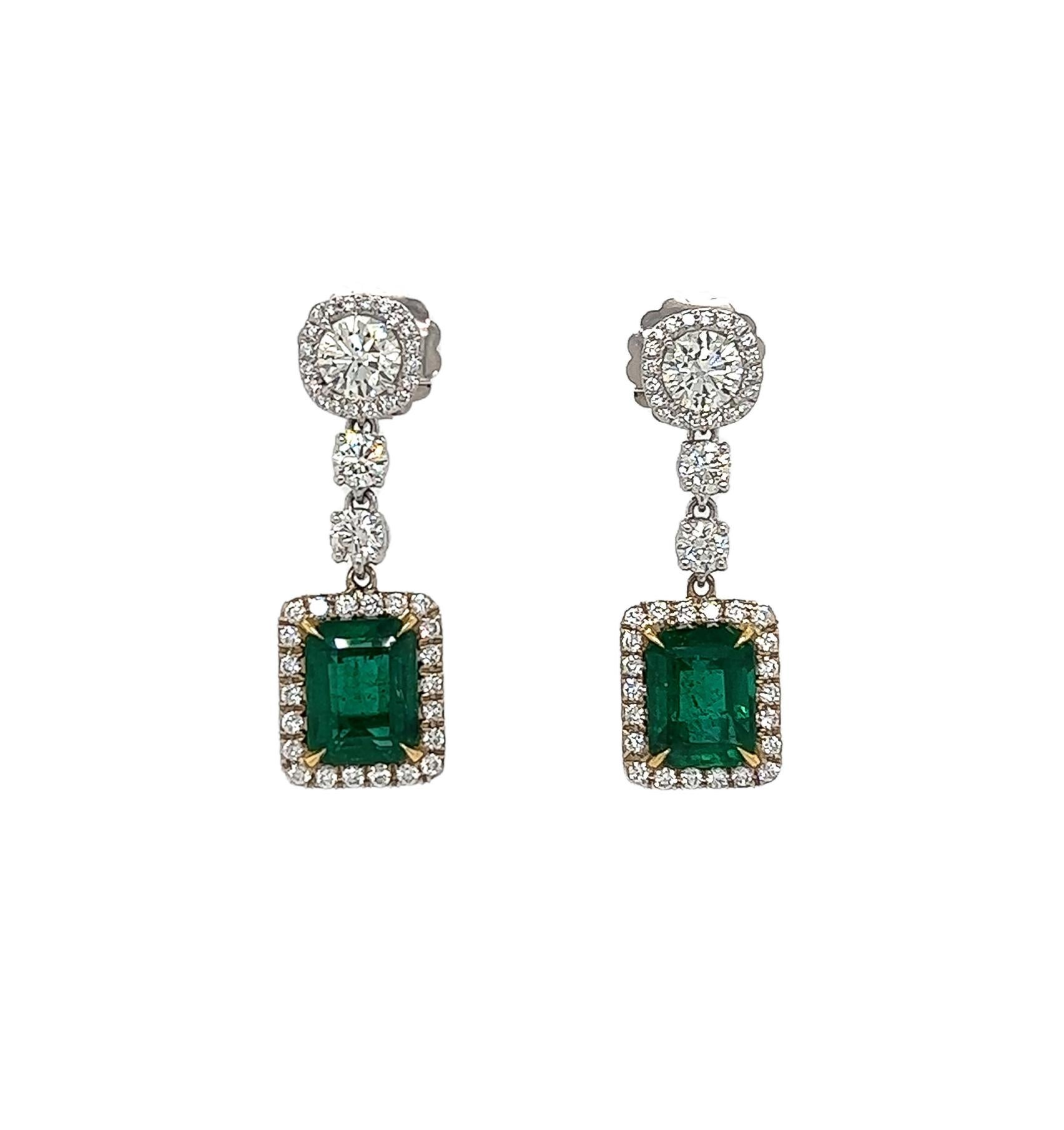 8.47 Total Carat Emerald and Diamond Drop Earrings in 18K White Gold

This gorgeous pair of Emerald earrings are sure to draw all eyes on you. It is created with a generous 5.41 Carats worth of emeralds, surrounded by a halo and drop of round cut