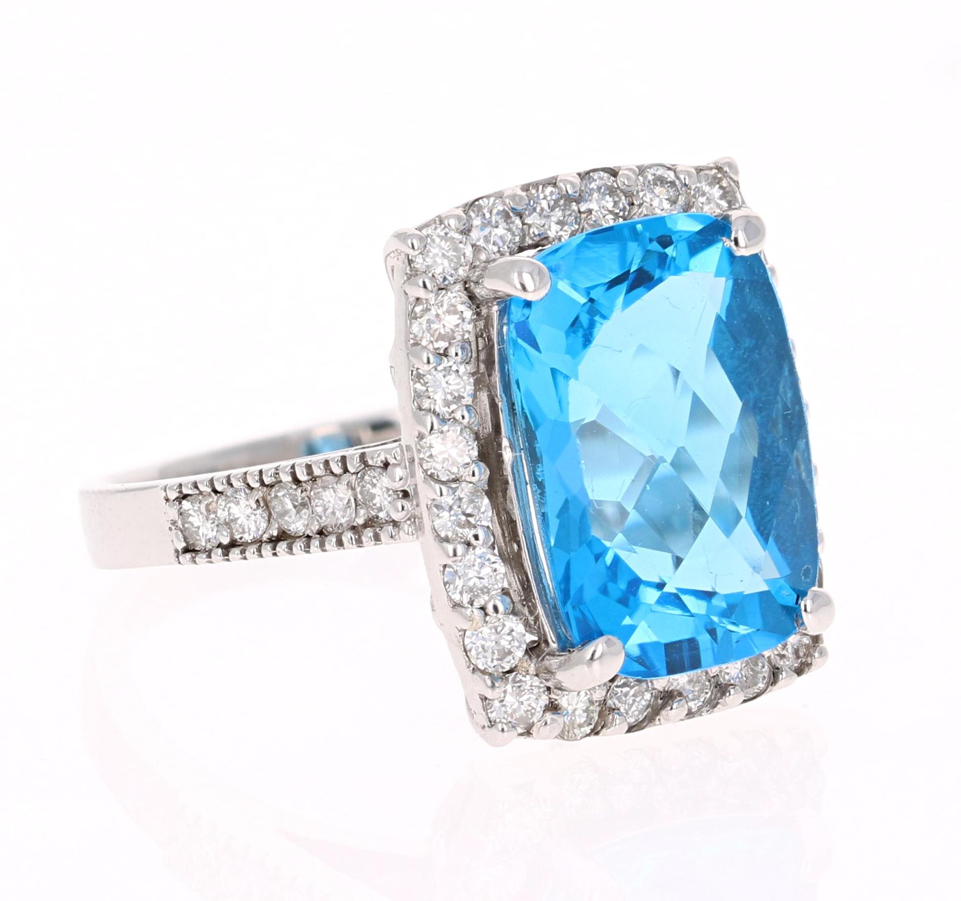 This beautiful Radiant-Cushion Cut Blue Topaz and Diamond ring has a stunningly large Blue Topaz that weighs 7.62 Carats. It is surrounded by 34 Round Cut Diamonds that weigh 0.87 Carats. The total carat weight of the ring is 8.49 Carats. 
The