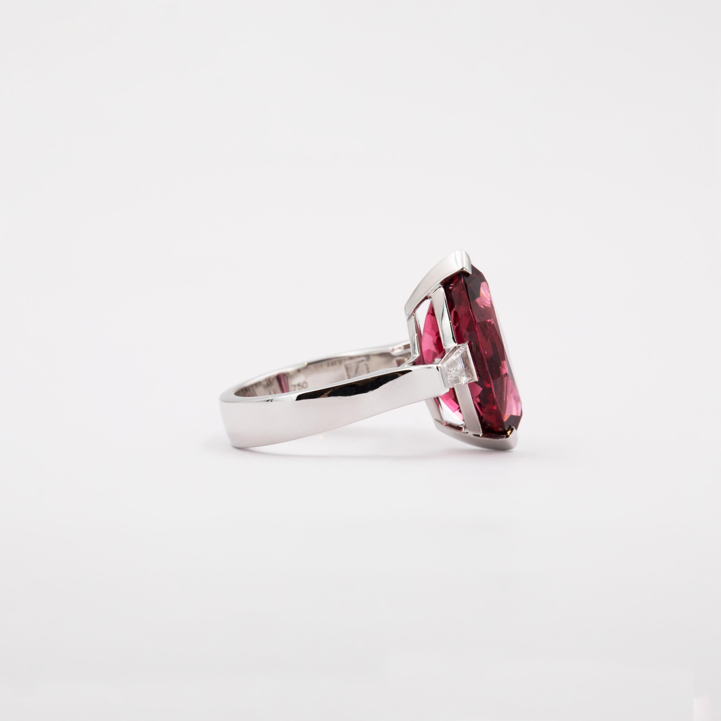 Tapered baguette diamonds weighing 0.59 carats ( F / VVS) complement the dynamic of this ring’s center-stone, set a steep angle to the 8.49 carat center stone. The vivid red spinel was sourced from Vietnam and is cut in a marquise shape. This
