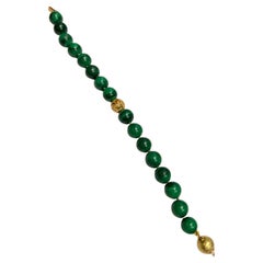 Malachite verde con chiusura in argento riempita d'oro