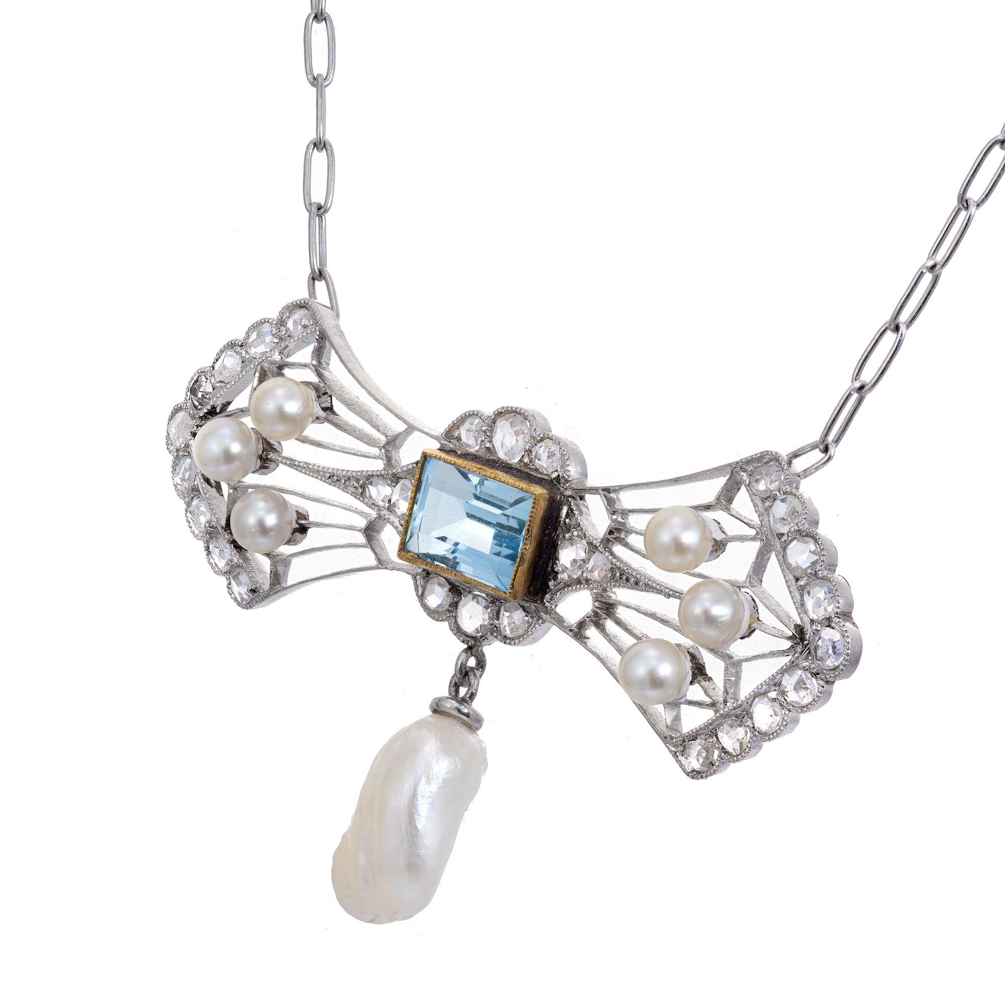 1890 to 1910 hand made Platinum delicate pendant necklace with natural untreated Aqua, natural round salt water pearls and a dangle natural Tennessee River fresh water pearl with 28 rose cut accent diamonds. 16.50 inches long.

1 natural light blue