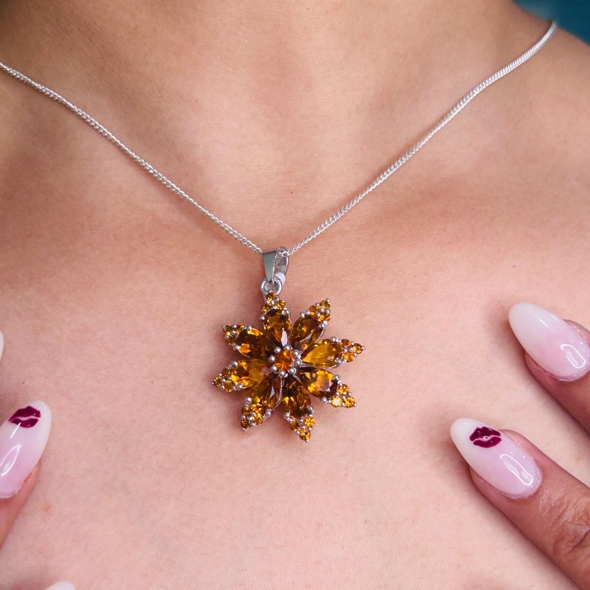 8.5 Carat Citrine Flower Sunburst Pendant for Women Necklace in sterling silver studded with round cut citrine. This stunning piece of jewelry instantly elevates a casual look or dressy outfit.
Citrine enhances the intellectual capacity of the