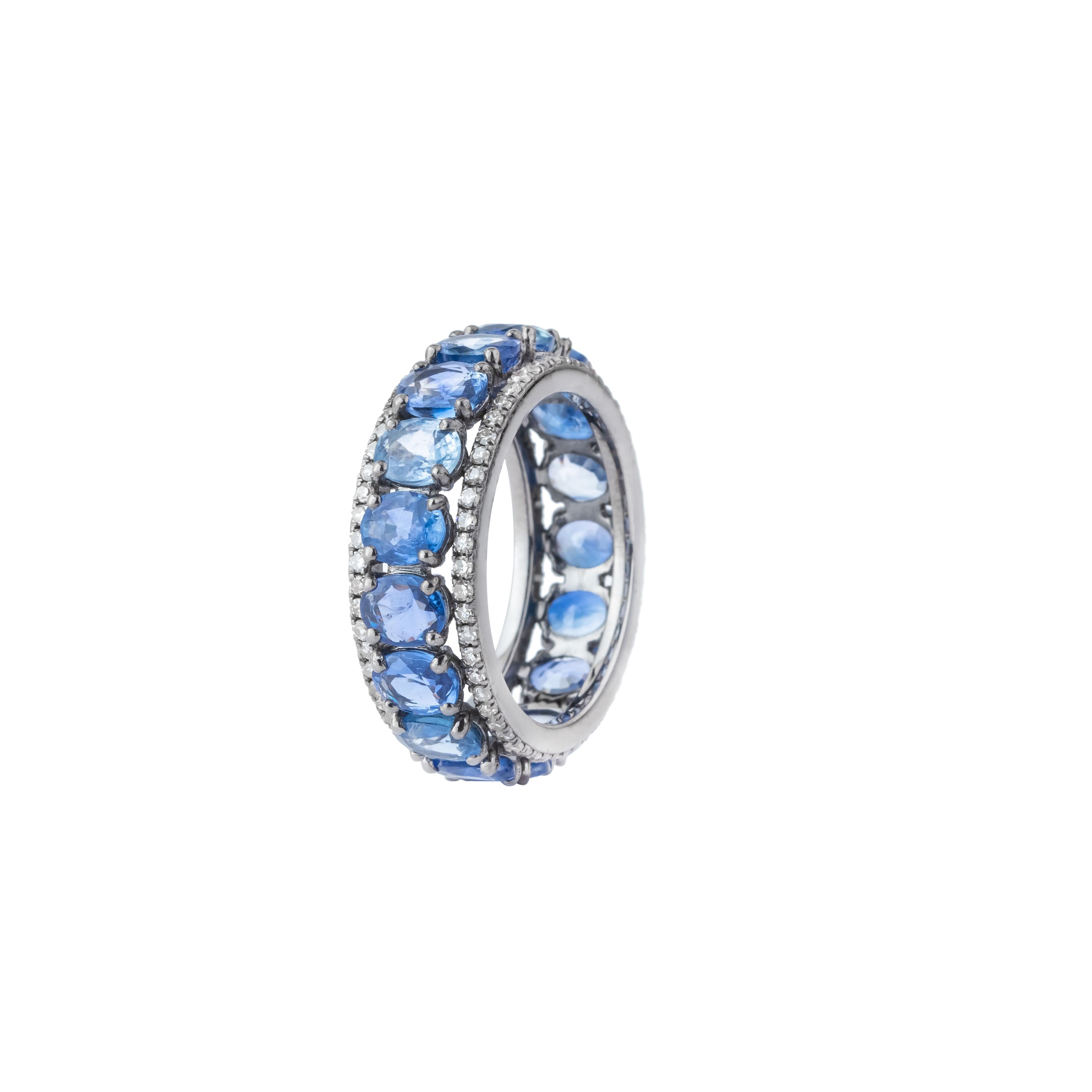 An exquisite embodiment of timeless elegance, this 8.5 Carat Diamond and Sapphire Eternity Band Ring epitomizes refined luxury. Meticulously crafted, this band features a seamless circle of alternating radiant diamonds and deep blue sapphires, each