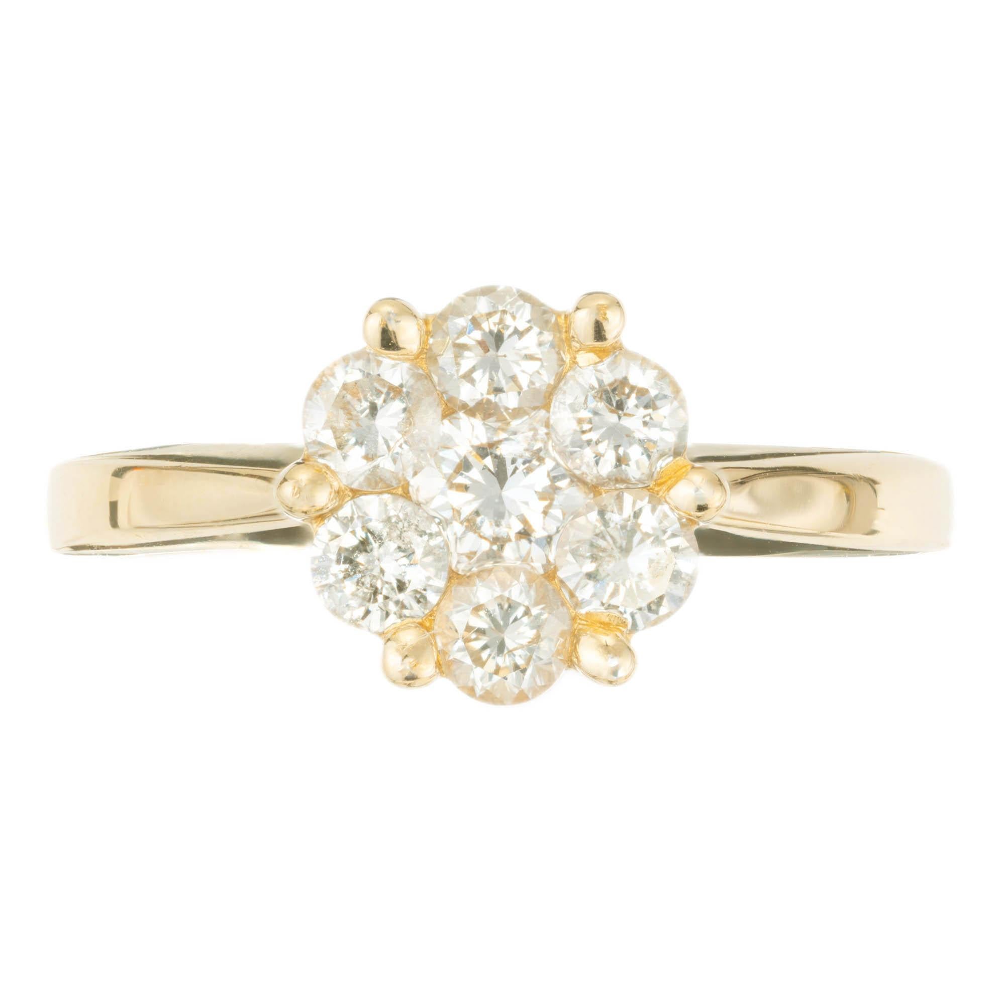 .85 carat diamond flower cluster engagement ring, in a 14k yellow gold setting. 

1 round brilliant cut H-I I diamond, Approximate .25 carats 
6 round brilliant cut H-I I diamonds, Approximate .60 carats 
Size 7 and sizable 
14k Yellow Gold