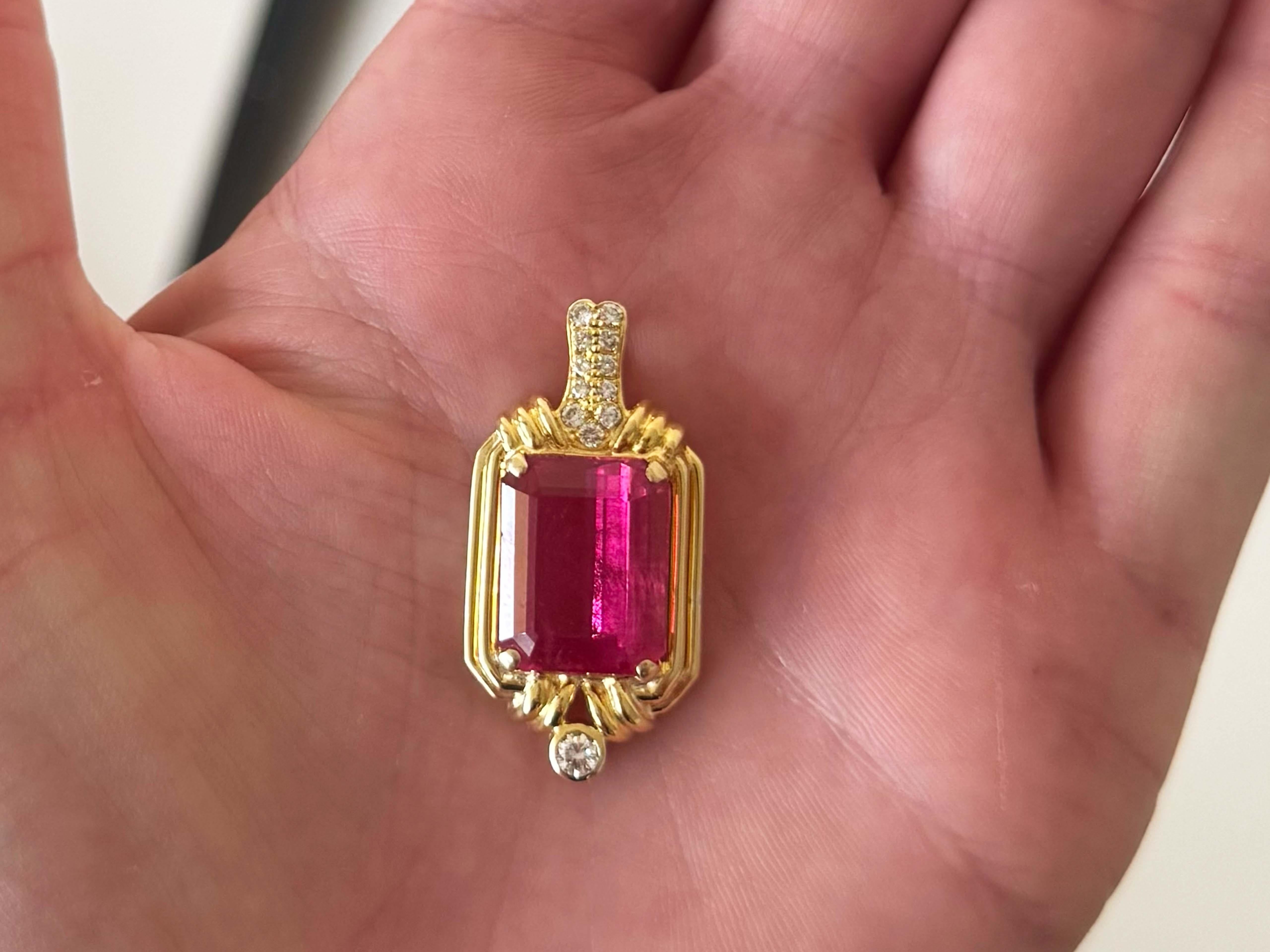 Item Specifications:

Pendant Metal: 18k Yellow Gold

Total Weight: 8.7 Grams
​
​Center Gemstone: 1 emerald cut pink tourmaline

Tourmaline Measurements: ~15.2 mm x 11.5 mm x 6.3  mm

Tourmaline Carat Weight: ~8.50 carats

Diamond Count: 12