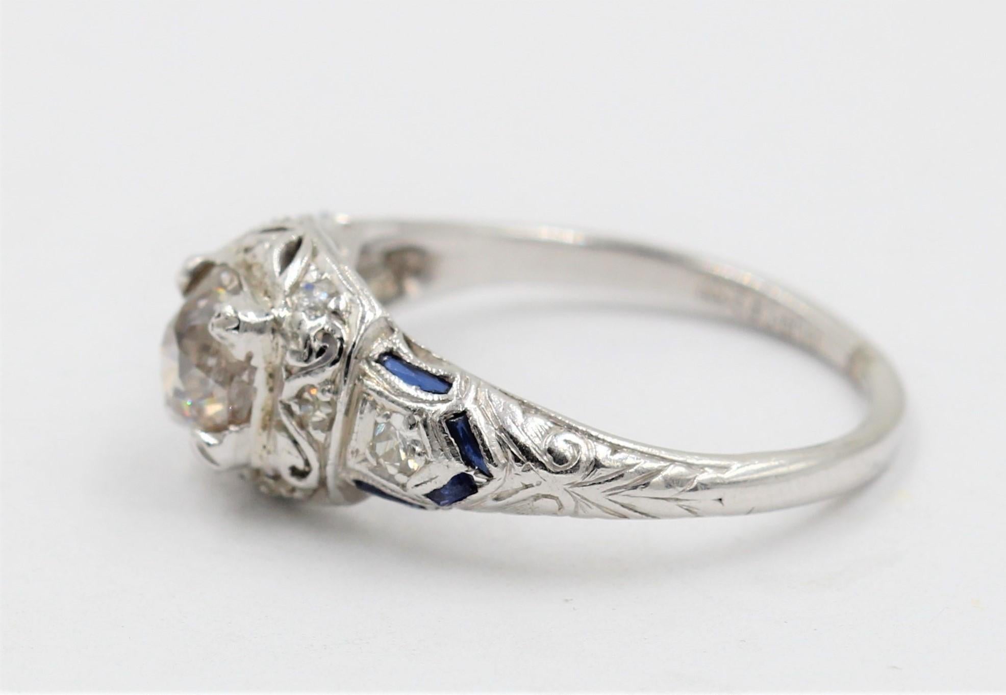 Old European Cut .85 Carat J/I3 Old Mine Cut Diamond Ring with Diamonds and Sapphires in Platinum For Sale