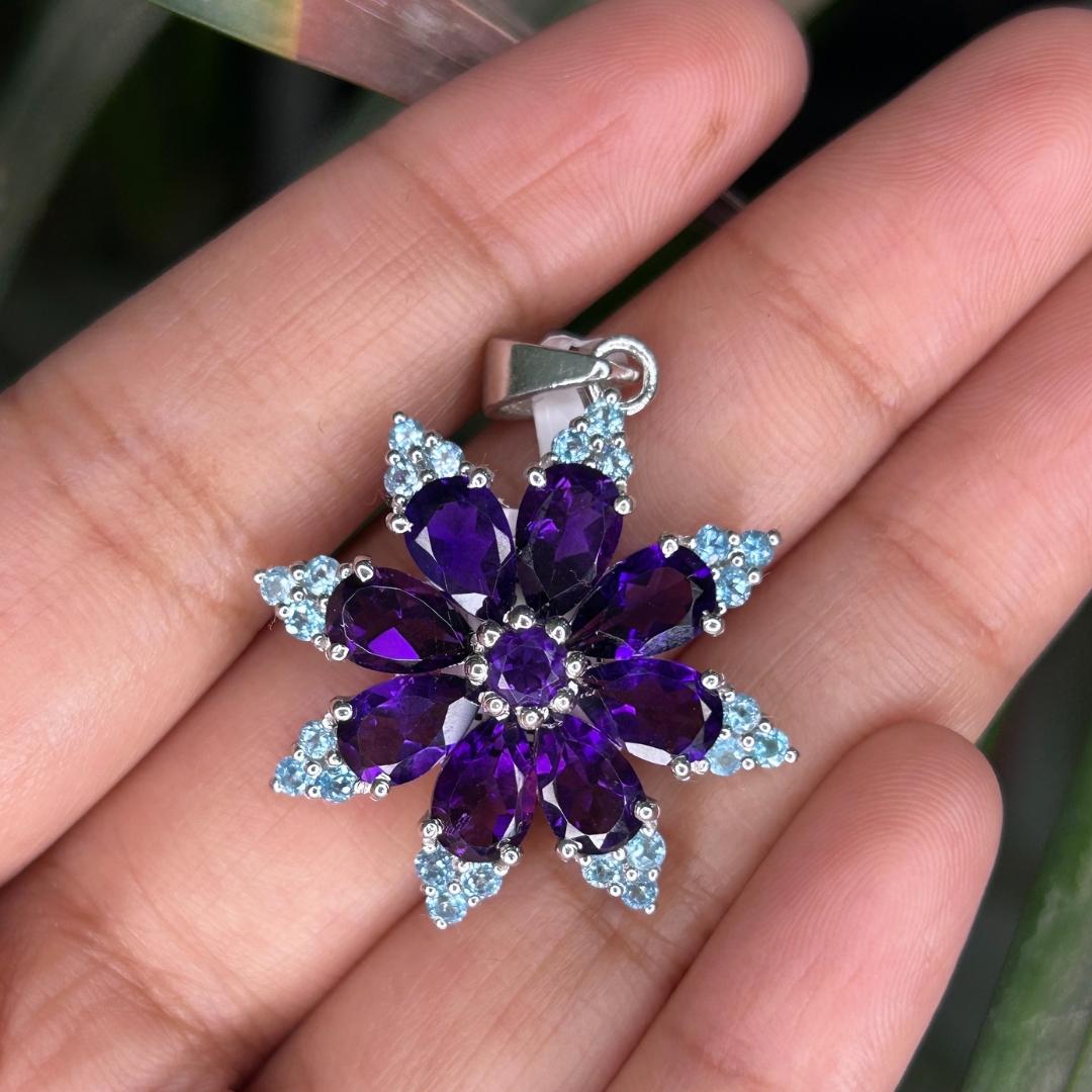 8.5 Carat Starburst Amethyst Blue Topaz Silver Pendant Necklace In 925 Sterling Silver New Year Gift studded with round, pear cut amethyst, blue topaz. This stunning piece of jewelry instantly elevates a casual look or dressy outfit. 
Amethyst, Blue