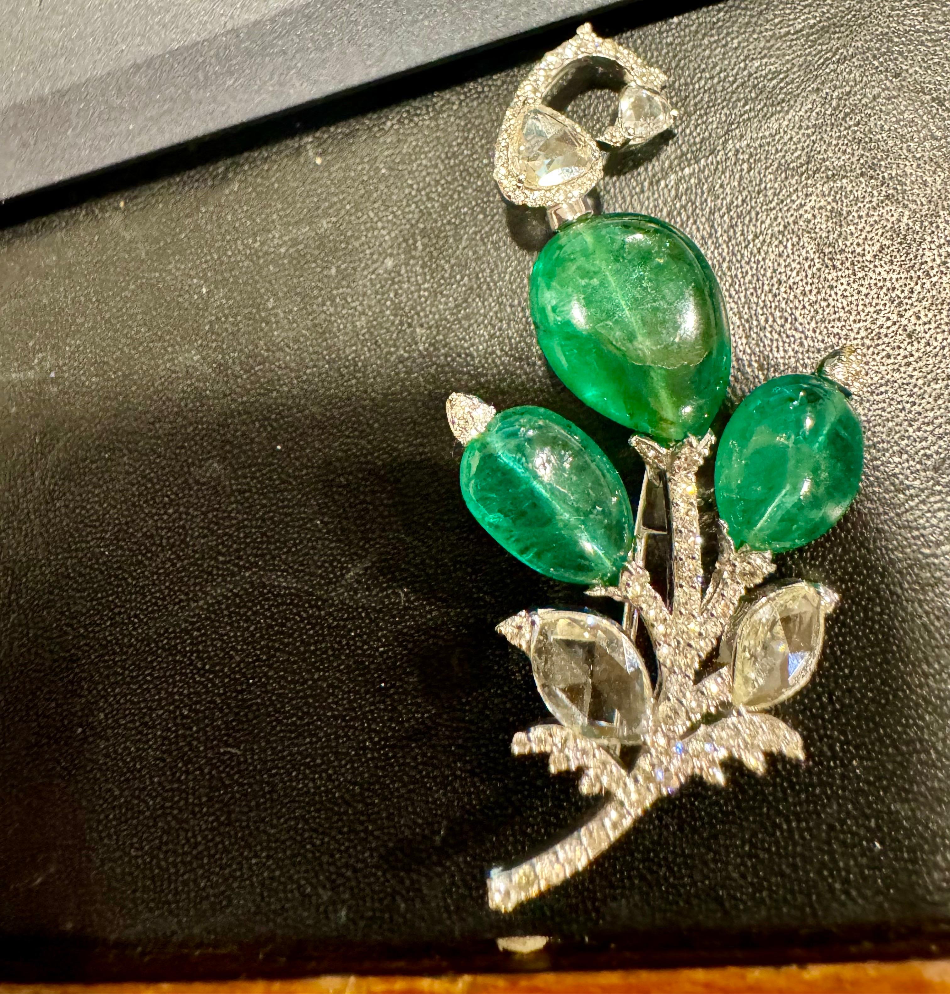 8.5 Ct Natural Oval Emerald Bead & 4 Ct Rose cut Diamond Brooch/Pin in 18 Karat white Gold. The approximate weight of the three emeralds is about 8 carats. The 18 Karat Gold weight is 7.5 grams, and the emeralds originate from Zambia. This exquisite