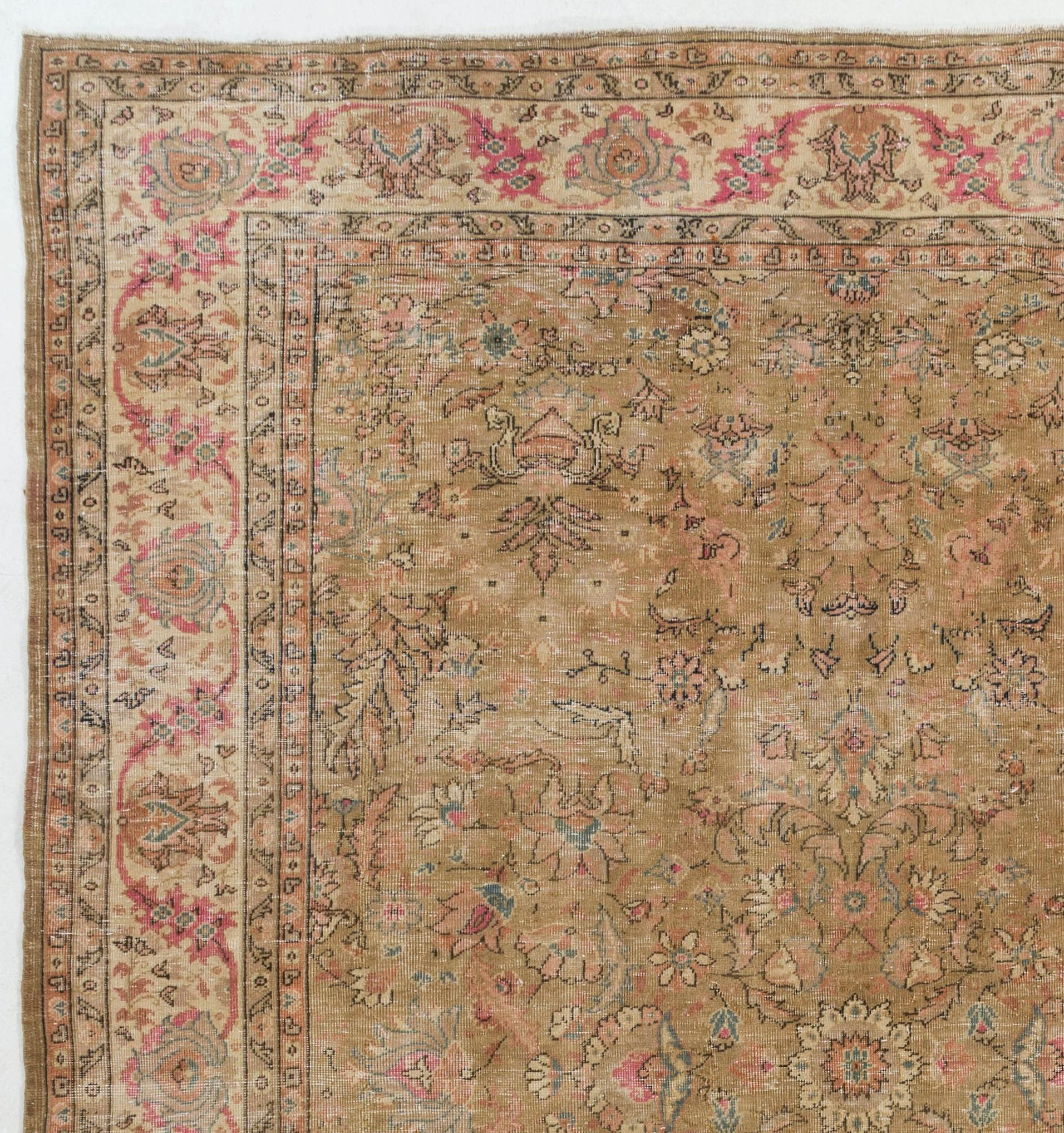 A highly decorative vintage hand-knotted Turkish Oushak rug with low wool pile on finely woven cotton foundation and a design that is extremely well defined and very detailed. The stylized outlines of gently scrolling leaves and large floral heads