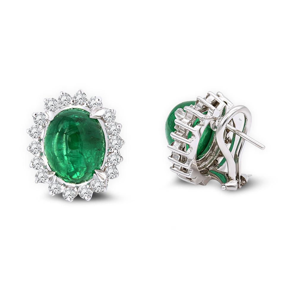 Ladies beautiful emerald and diamond stud earrings.
Center stones contain 8.50 carat Oval Cabochon emeralds.
Surrounded by a diamond halo 0.85 carat TW round brilliant cut diamonds.
Mounted in 14k white gold.
Emerald Cabochon canter stones are