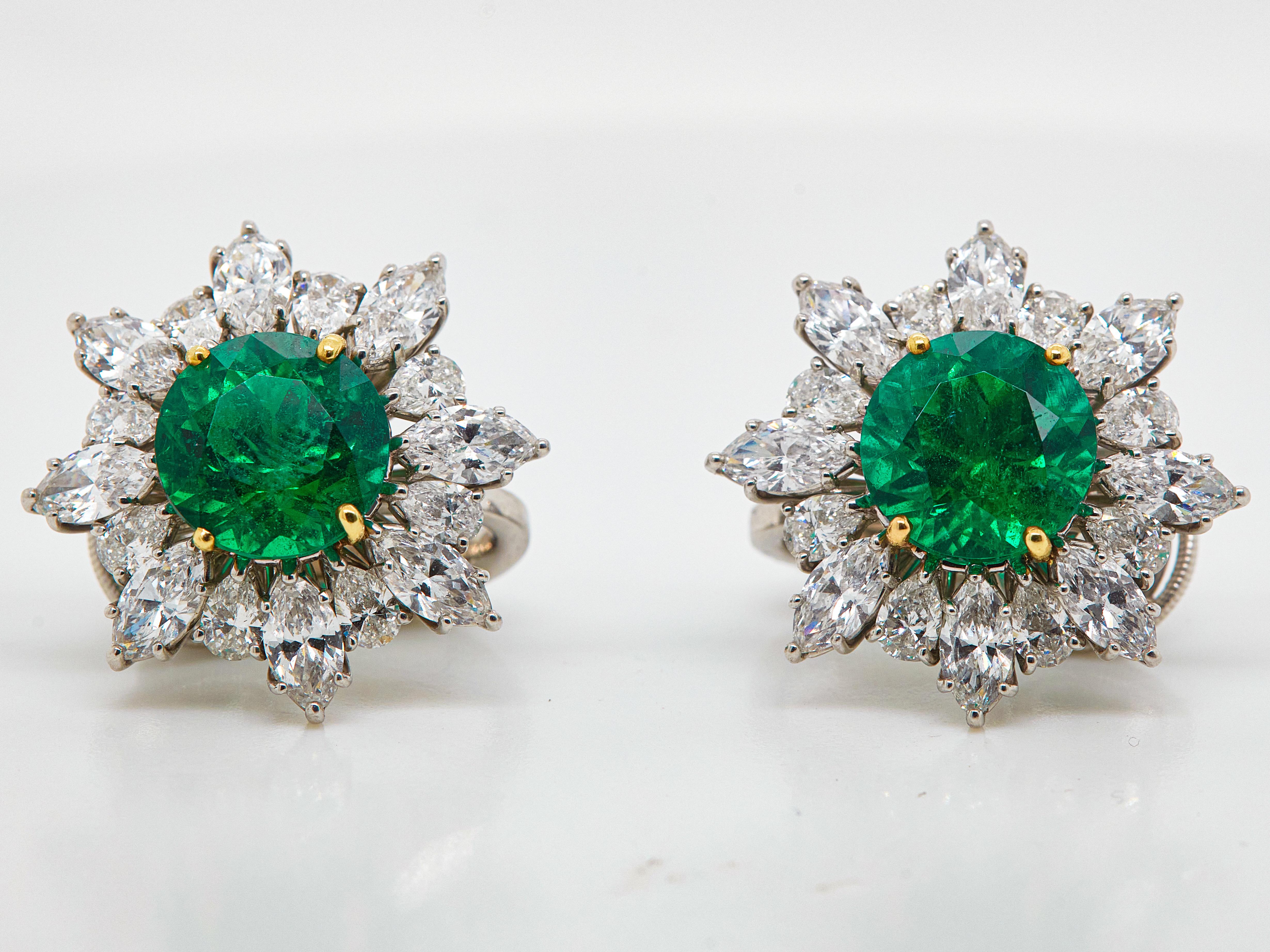 Absolutely stunning 8.58 Carat Vivid green excellent cut round Emerald Diamond Stud Earrings. AGTA Certified as Round-cut. Set with 16 Marquise-cut white diamonds totaling in 4.19 carat and 16 pearl-shaped diamonds totaling in 1.92 carat. Set in a