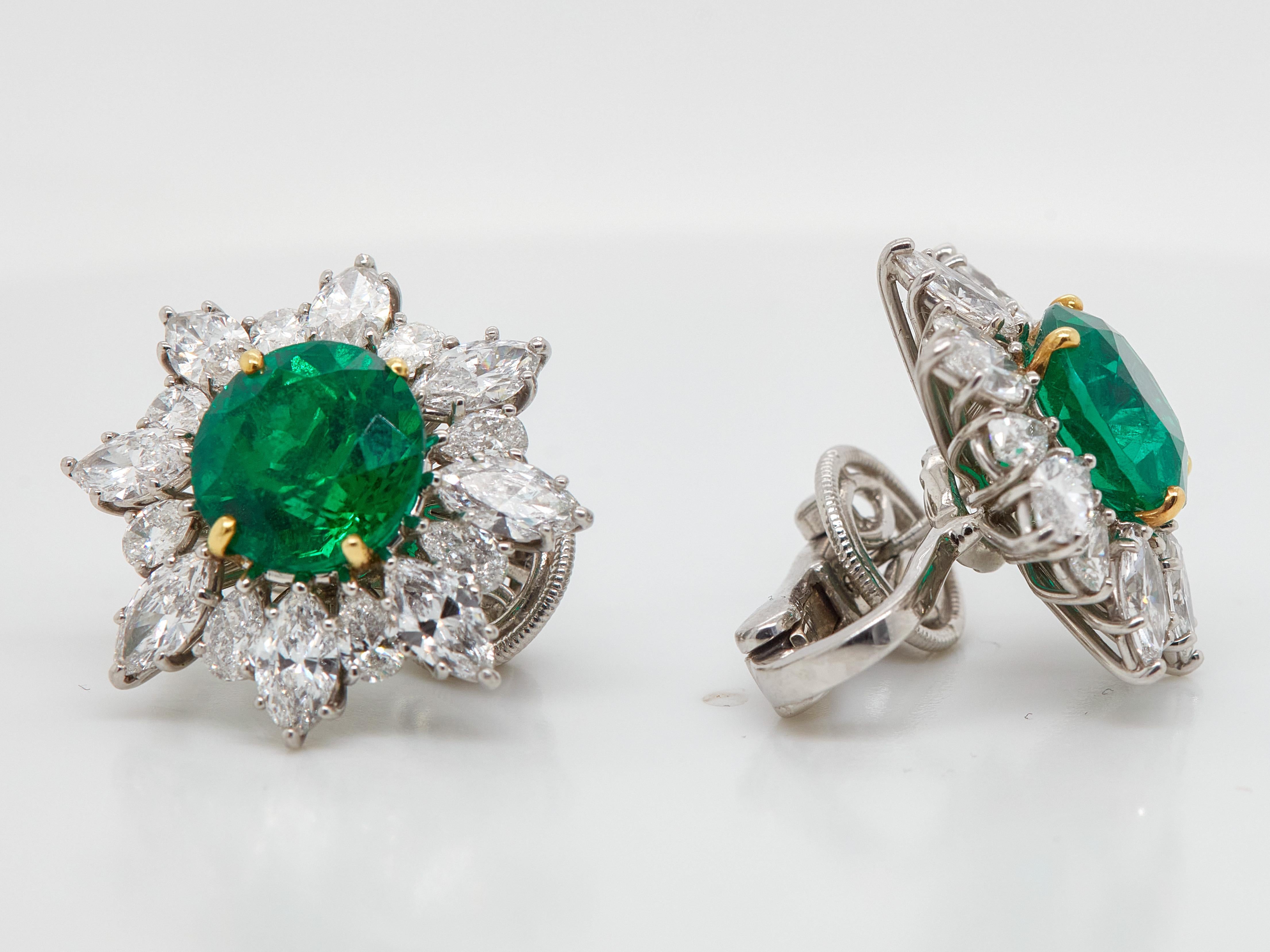 Absolutely stunning 8.58 Carat Vivid green excellent cut round Emerald Diamond Stud Earrings. AGTA Certified as Round-cut. Set with 16 Marquise-cut white diamonds totaling in 4.19 carat and 16 pearl-shaped diamonds totaling in 1.92 carat. Set in a