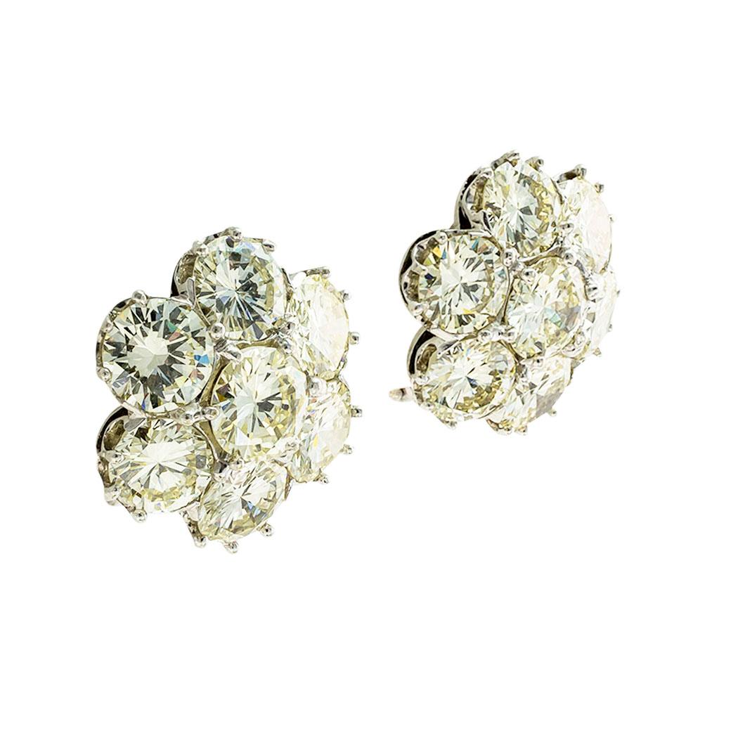 Lite yellow color 8.50 carats diamond cluster clip and post white gold earrings circa 1935*

SPECIFICATIONS:

DIAMONDS: fourteen, very bright, round brilliant transitional cut diamonds totaling approximately 8.50 carats, lite yellow color, VS-SI