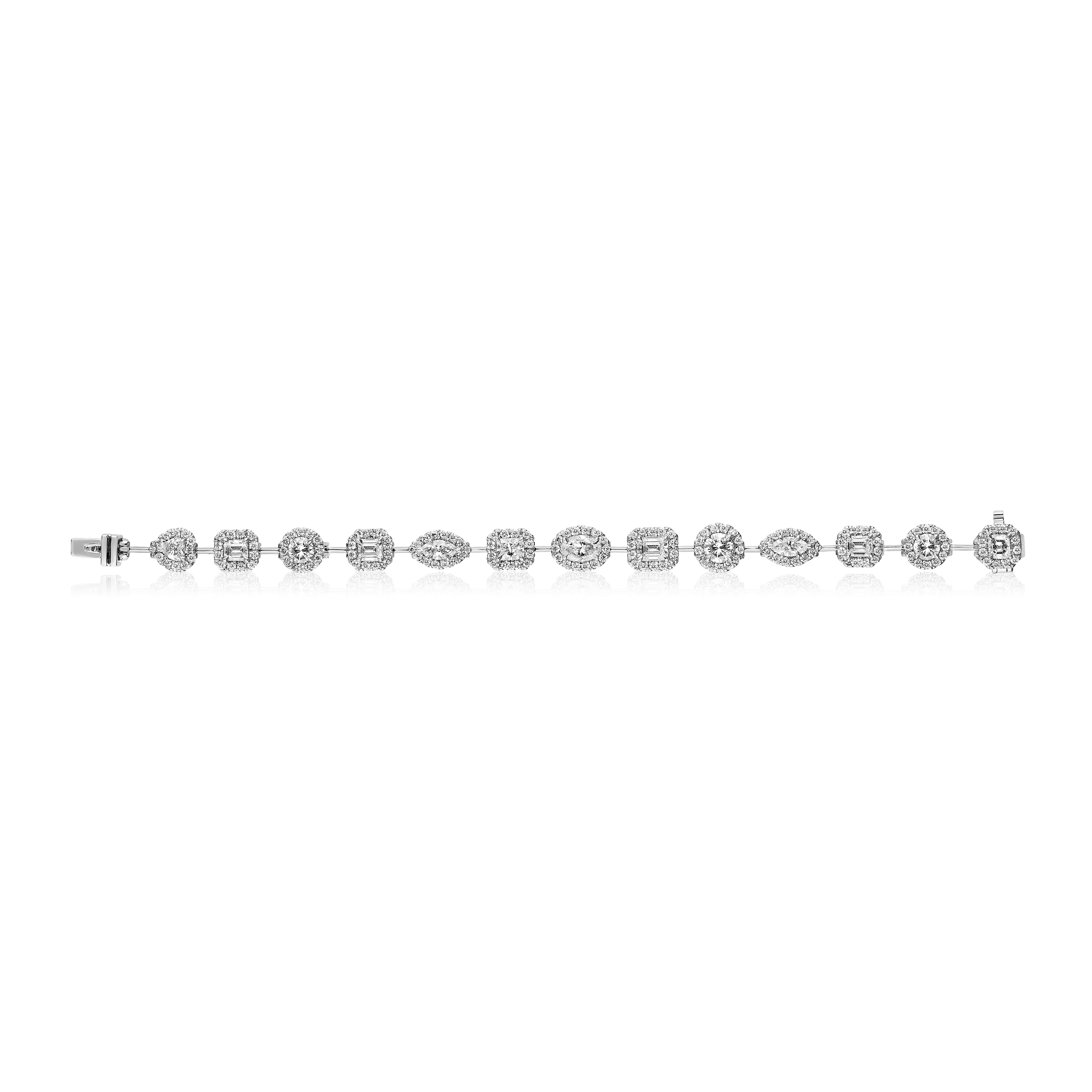 13 Multi Shaped Diamond Set each surrounded with a Row of Round Brilliant Diamonds.
Approximately 8.50 Carats Total.
Set in Platinum.
Measures 6.5 Inches.