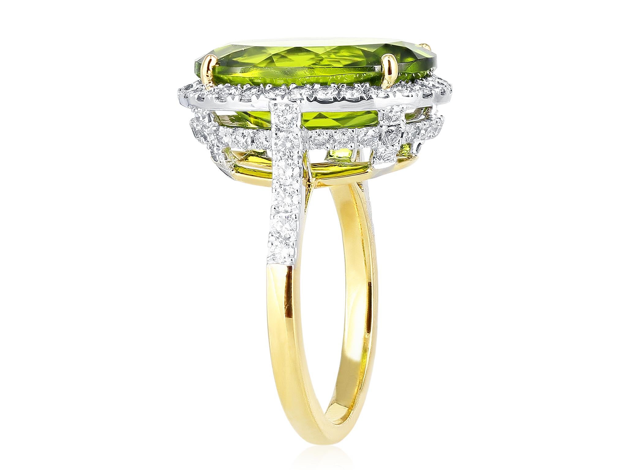 18 karat yellow gold oval peridot weighing approximately 8.50 carats and diamond 1.20 carats cluster ring.