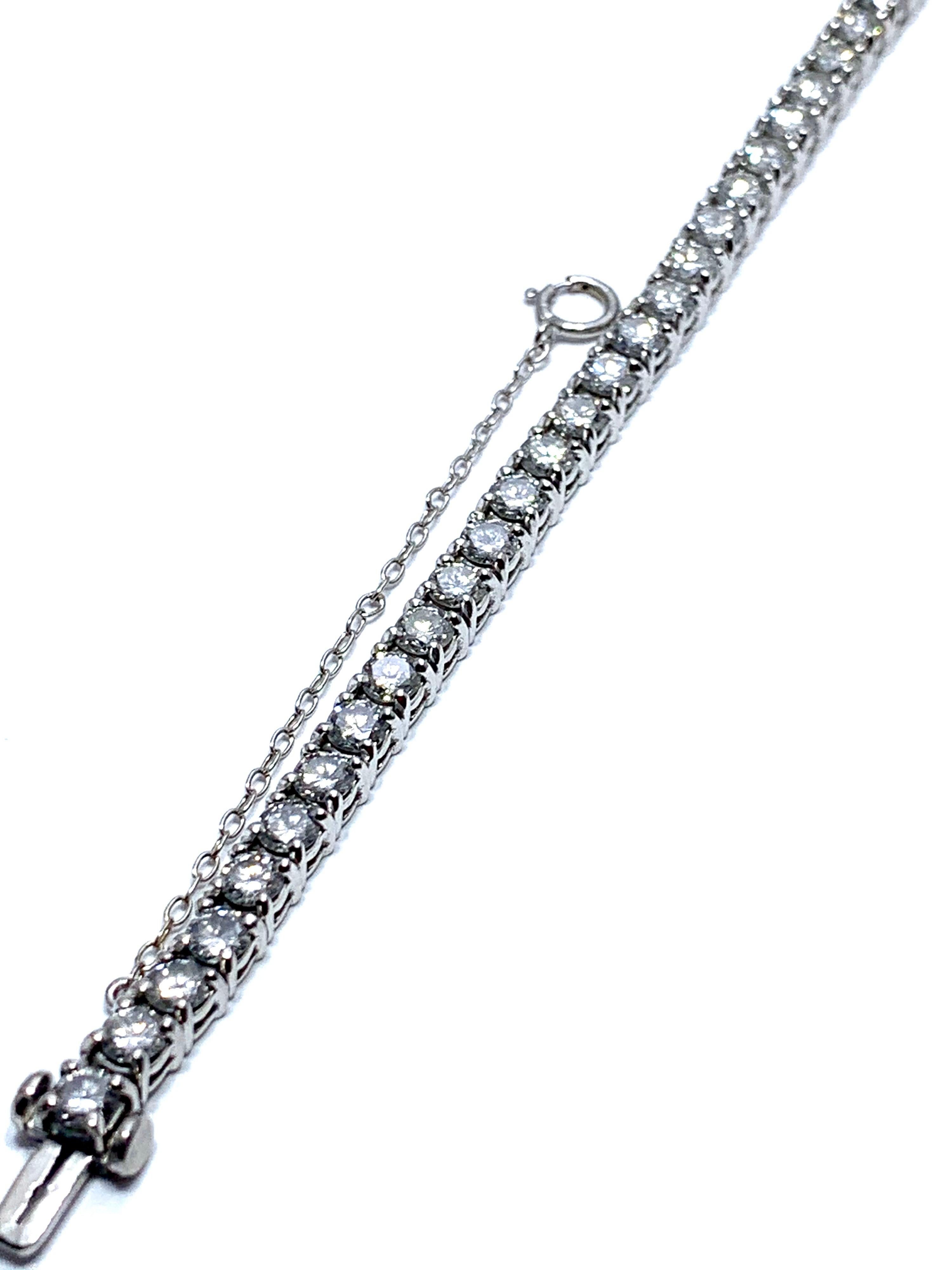 This is a beautiful 8.50 carat round brilliant Diamond tennis bracelet set in platinum.  The diamonds are set with four prongs each, with a tongue and groove push button clasp, including a safety catch for piece of mind.  The diamonds are graded as