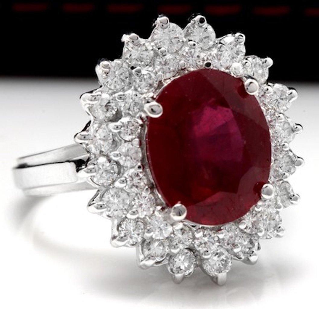 8.50 Carats Impressive Red Ruby and Natural Diamond 14K White Gold Ring

Total Red Ruby Weight is: Approx. 7.00 Carats

Ruby Treatment: Lead Glass Filling

Ruby Measures: Approx. 11.00 x 9.00mm

Natural Round Diamonds Weight: Approx. 1.50 Carats
