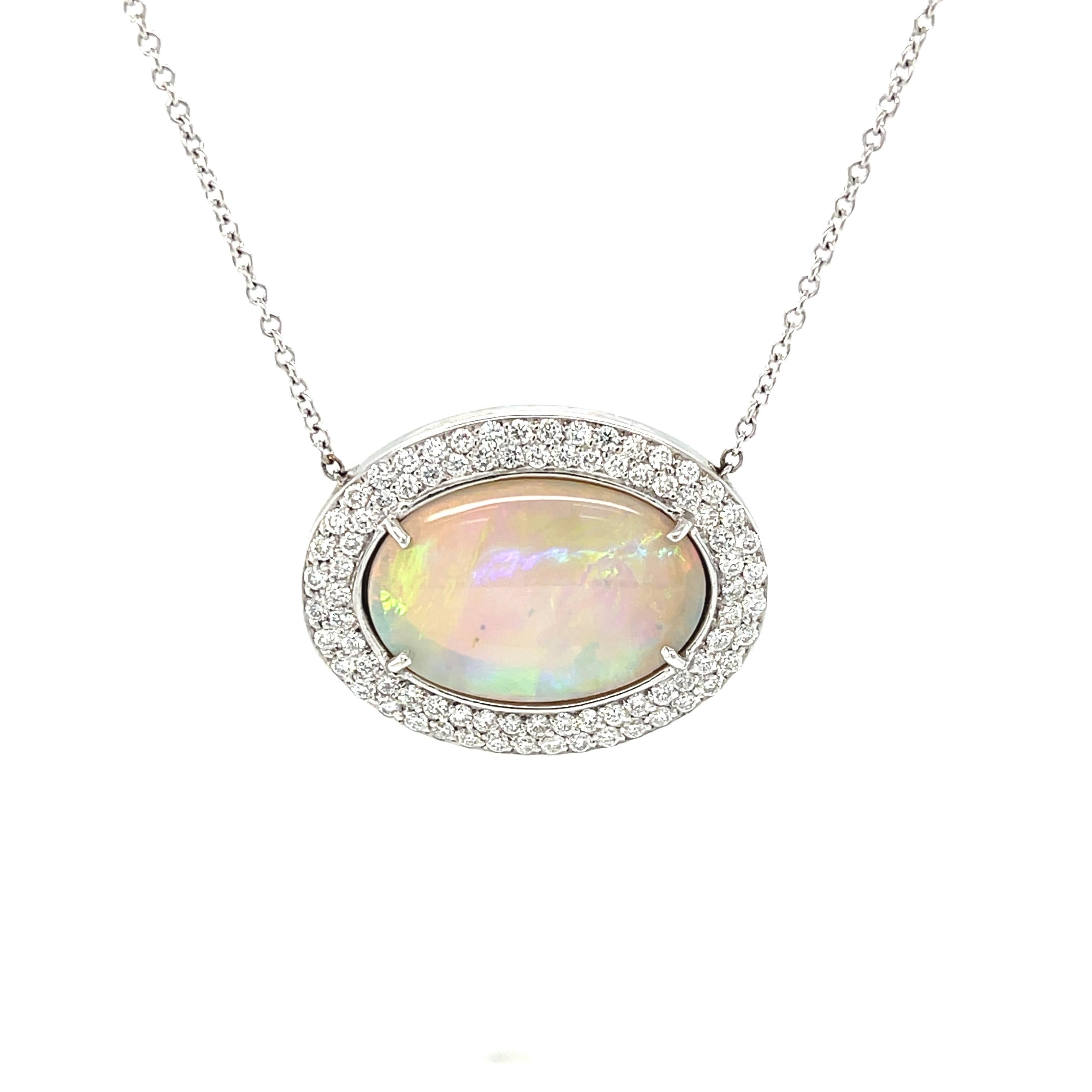 This gorgeous necklace will go with everything! It features a large, beautiful Australian opal that displays striking patches of red, yellow, orange, green and violet play-of-color or 