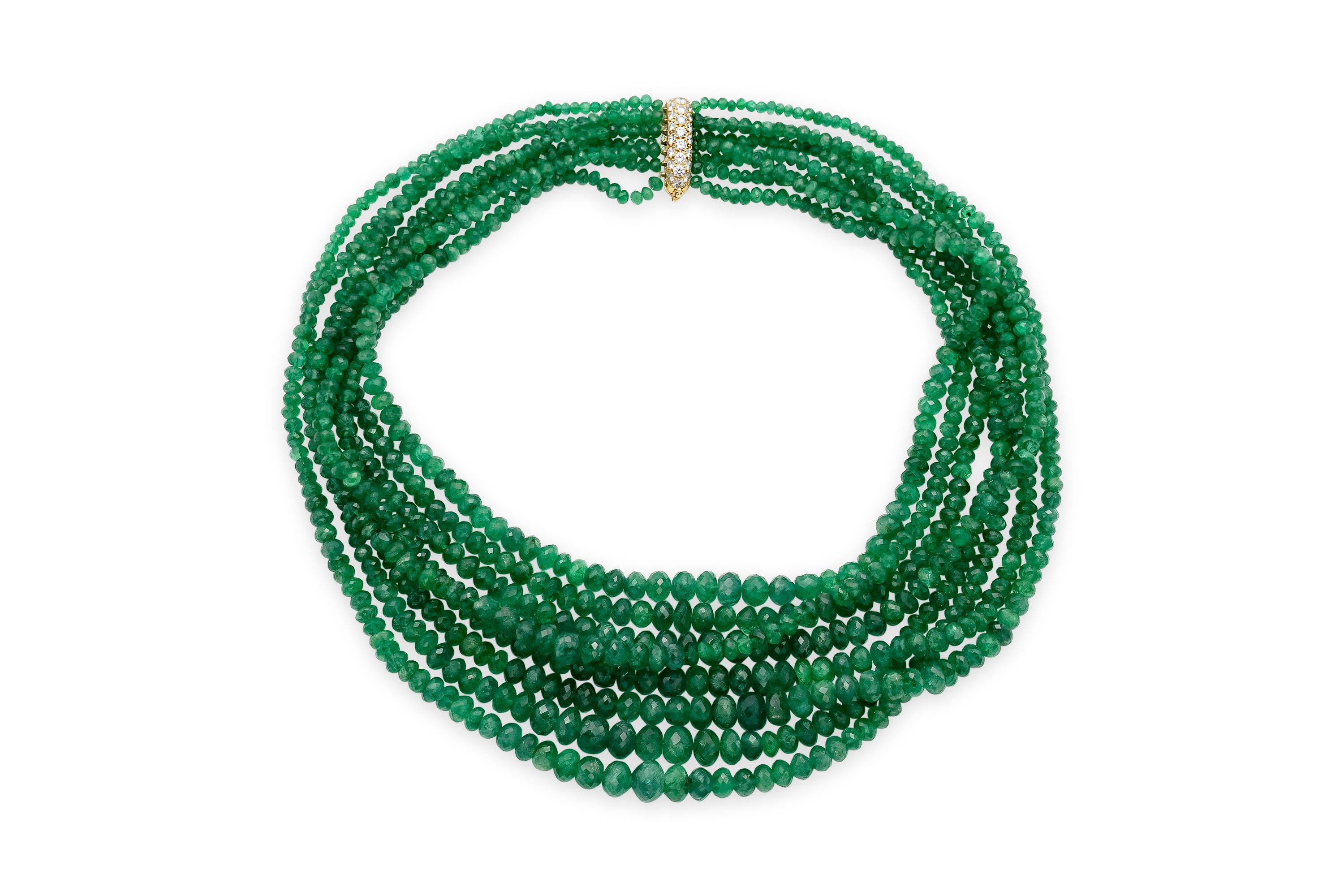 Finley crafted with 6 strands of Emerald beads weighing approximately a total of 850.00 carats.
The clasp is crafted in 18k yellow gold featuring 1.50 carats of Round Brillinat cut diamonds.