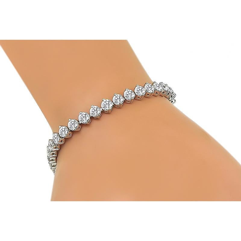 This is an elegant 14k white gold tennis bracelet. The bracelet is set with sparkling round cut diamonds that weigh approximately 8.50ct. The color of these diamonds is G with VS1-SI1 clarity. The bracelet measures 6 1/2 inches in length and 5mm in