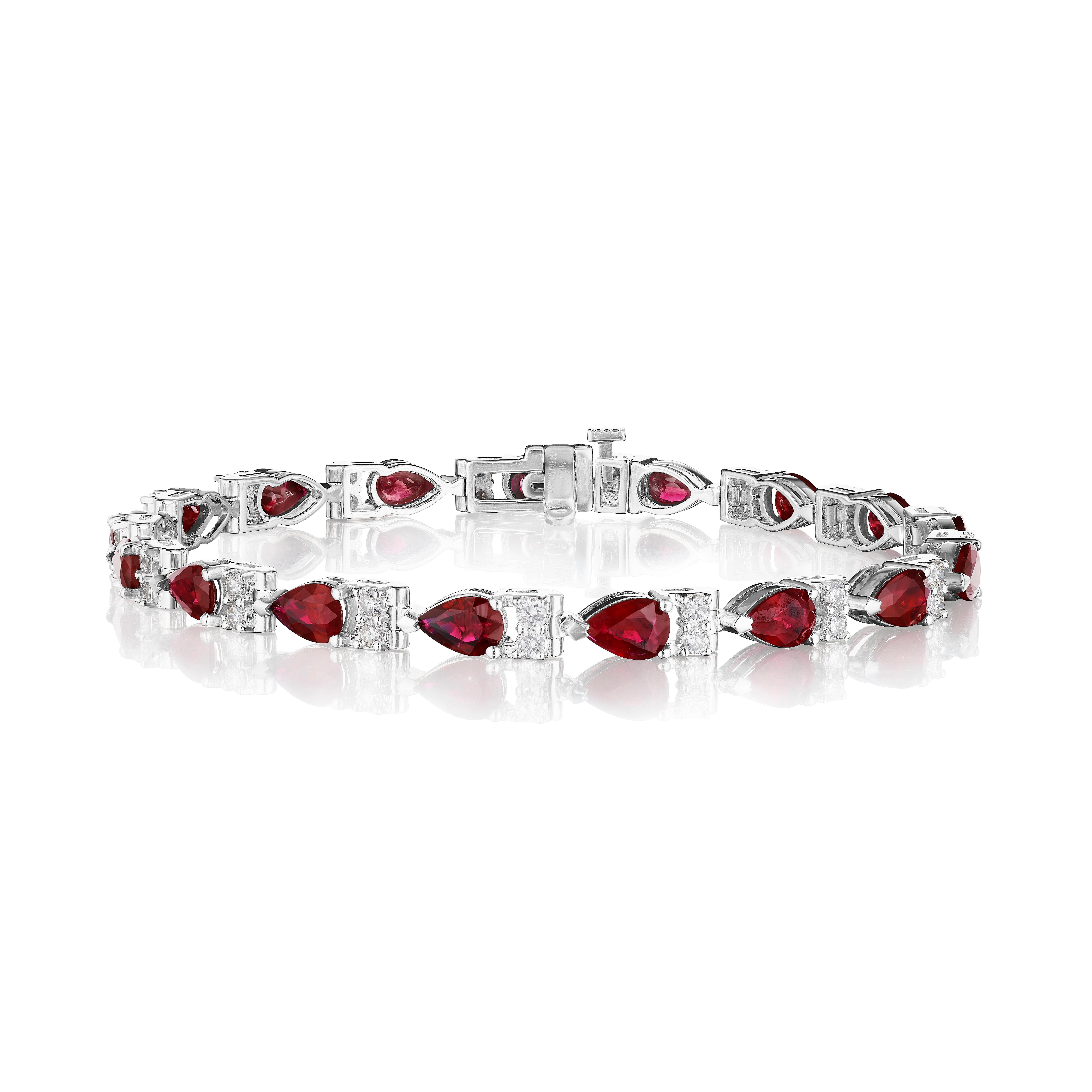 •	A beautiful row of red pear shape rubies and white round brilliant cut diamonds encircle the wrist in this bracelet, set in 14KT gold. The bracelet measures 7