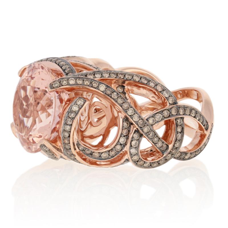 This ring is a size 6 1/2.

Metal Content: Guaranteed 10k Gold as stamped

Stone Information: 
Genuine Morganite 
Color: Pink
Cut: Round 
Diameter: 13.1mm 
Carat: 7.50ct

Natural Diamonds  
Clarity: SI2 - I1 
Color: Champagne Brown   
Cut: Round