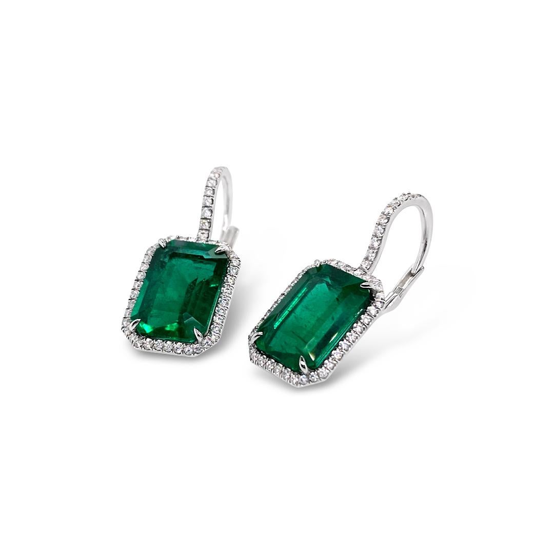 8.52 Carats (total weight) Emerald and Diamond Halo drop earrings set in Platinum.  Total diamond weight is 0.65 Carat.