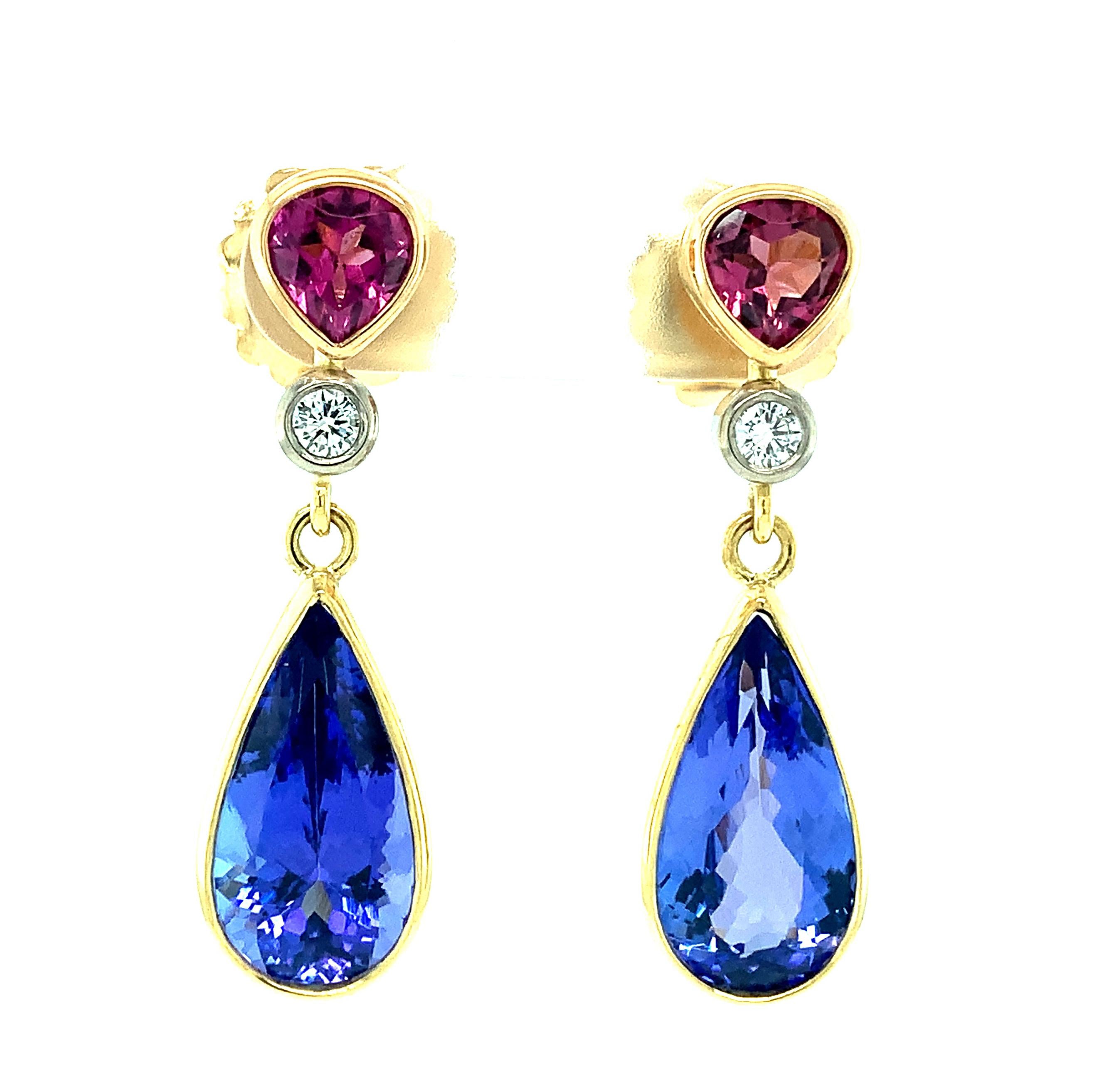 Color, shape and proportion define these beautiful, one-of-a-kind earrings. All stones are bezel set in 18k gold, made by our Master Jewelers in Los Angeles. A large pair of beautifully matched, gem quality tanzanites are featured in these earrings.