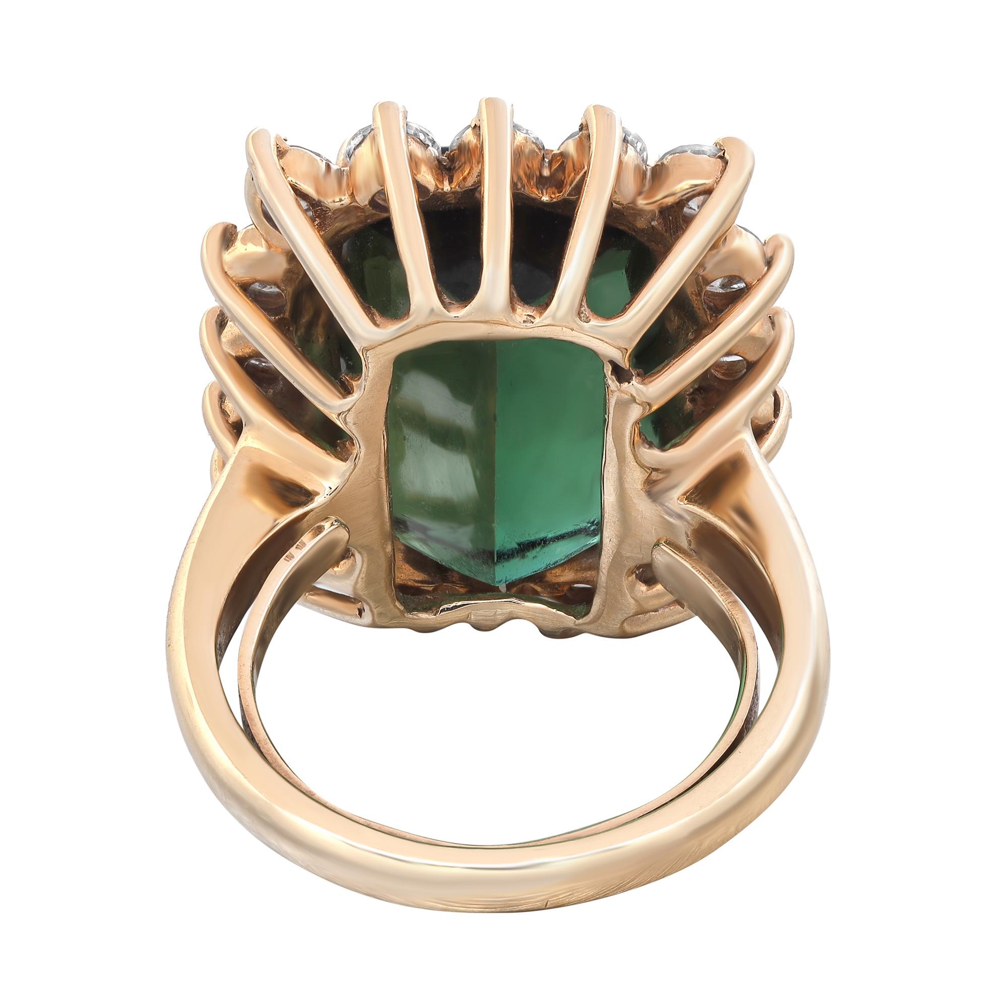 This amazingly beautiful ring features a lively and large rectangular antique cushion cut green Tourmaline weighing 8.53 carats that sits atop a halo of 18 round brilliant cut diamonds weighing 1.80 carats approx. Diamond quality: color G and