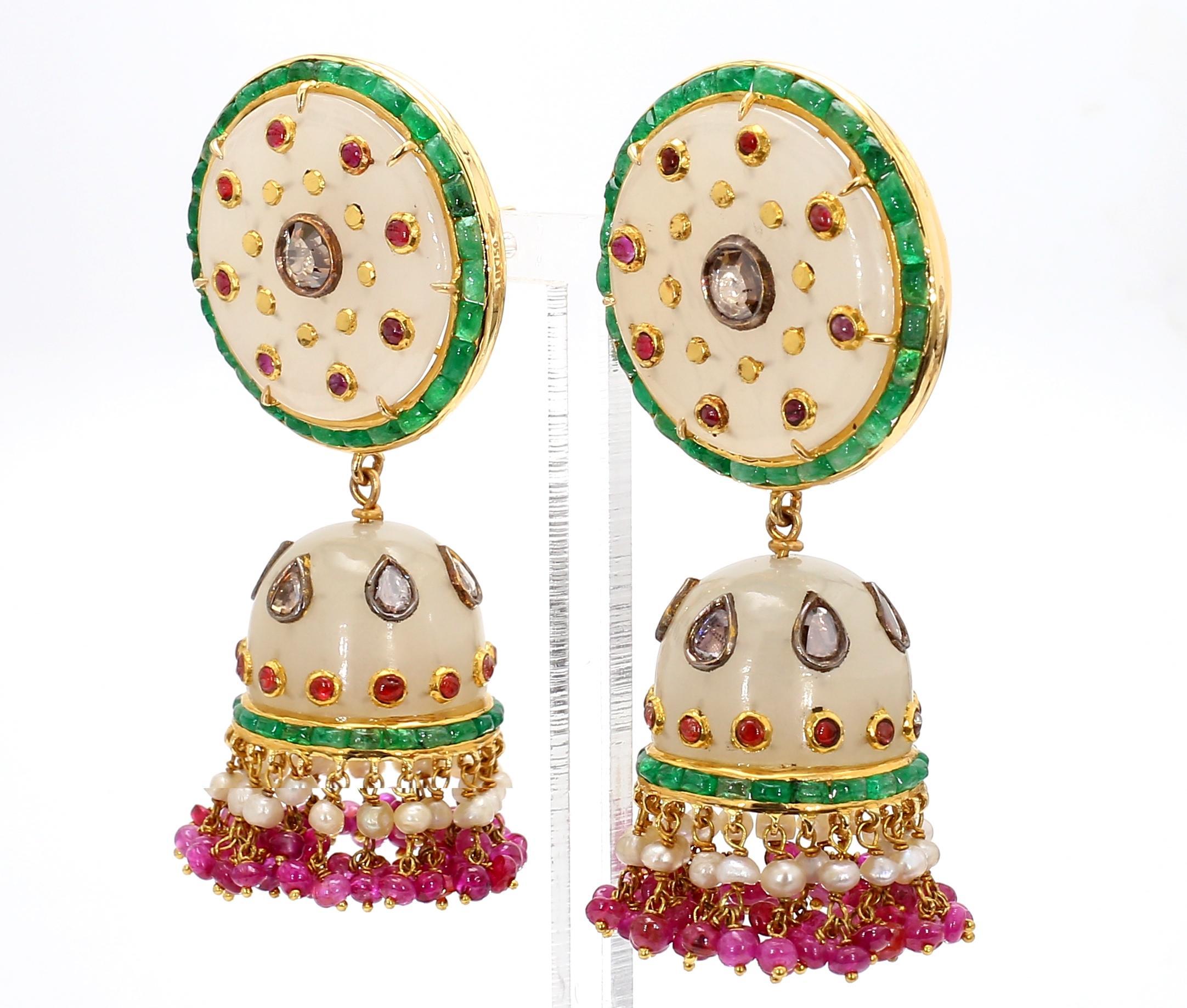 Experience the timeless elegance of Old Persian craftsmanship with these exquisite Old Persian Jade Earrings. Masterfully designed, these earrings feature a luxurious blend of 8.54 carats of baguette-cut emeralds, 2.40 carats of round rubies, and