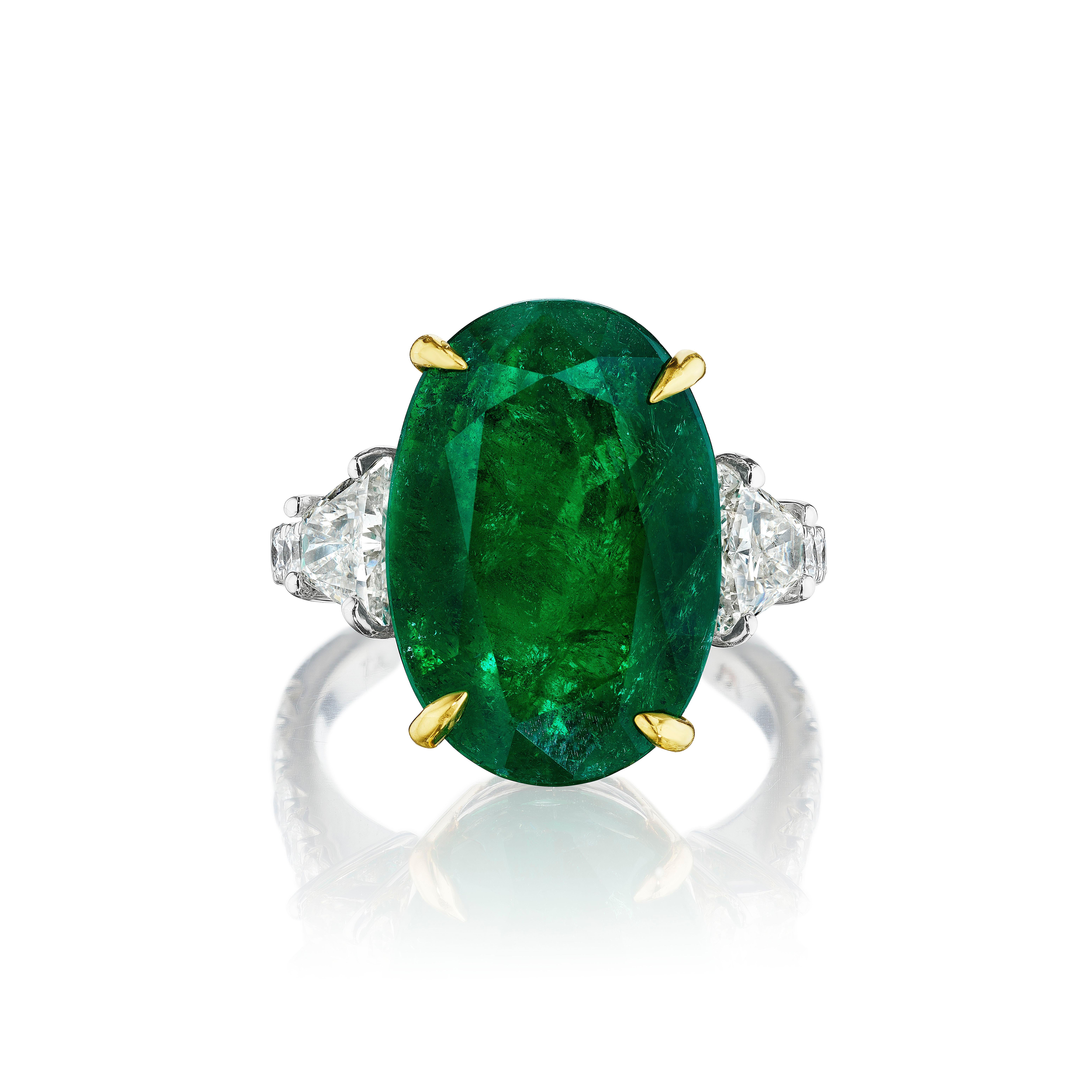 Oval Cut 8.54ct Oval Emerald with Brilliant Trapezoid and Round Diamond Ring For Sale