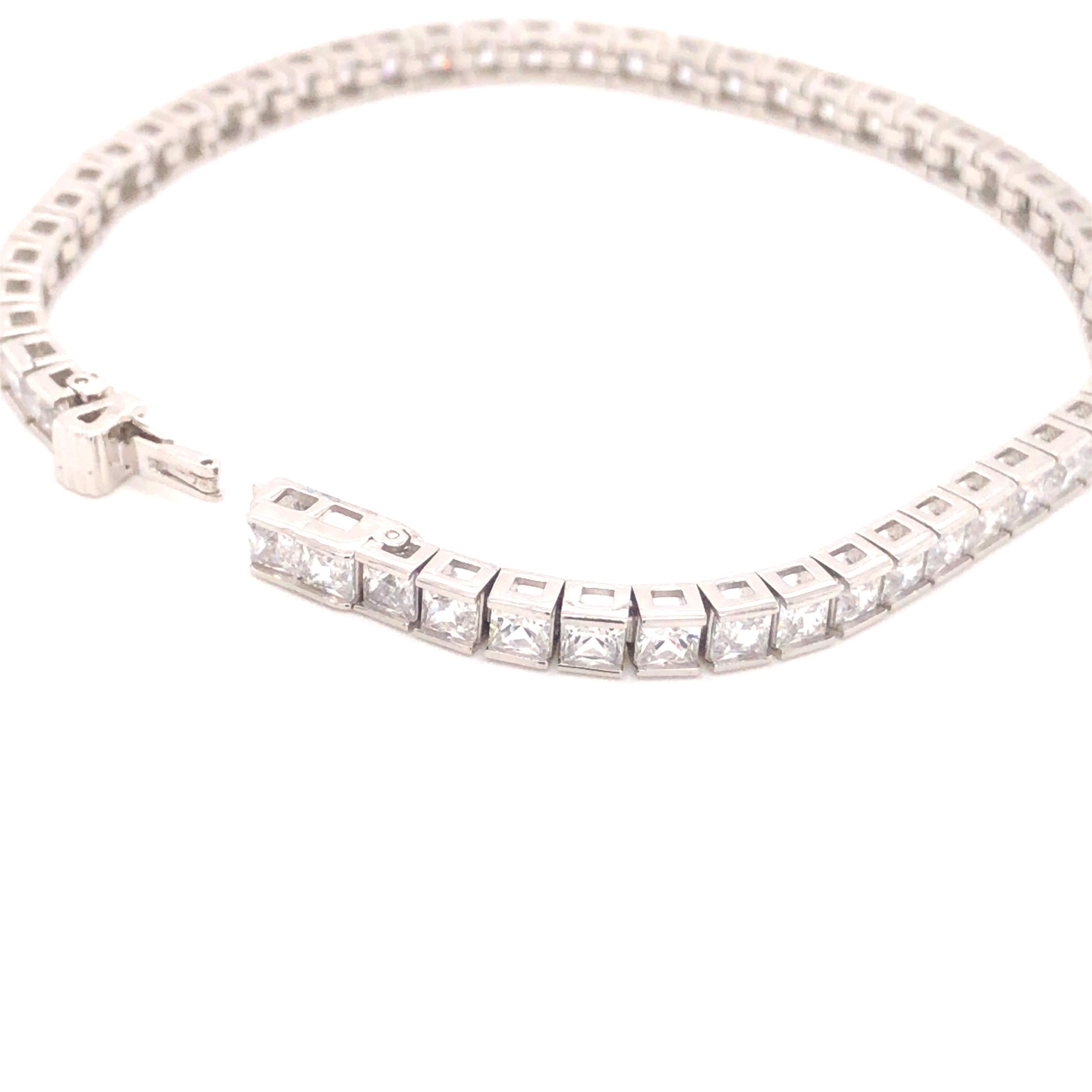 This fabulous tennis bracelet is embellished with 8.55ct of invisibly set sparkling princess cut cubic zirconia and is a real show stopper.

Conposed of 925 sterling silver with a polished platinum finish.

Dimensions 7.5 inches.

Whether you're