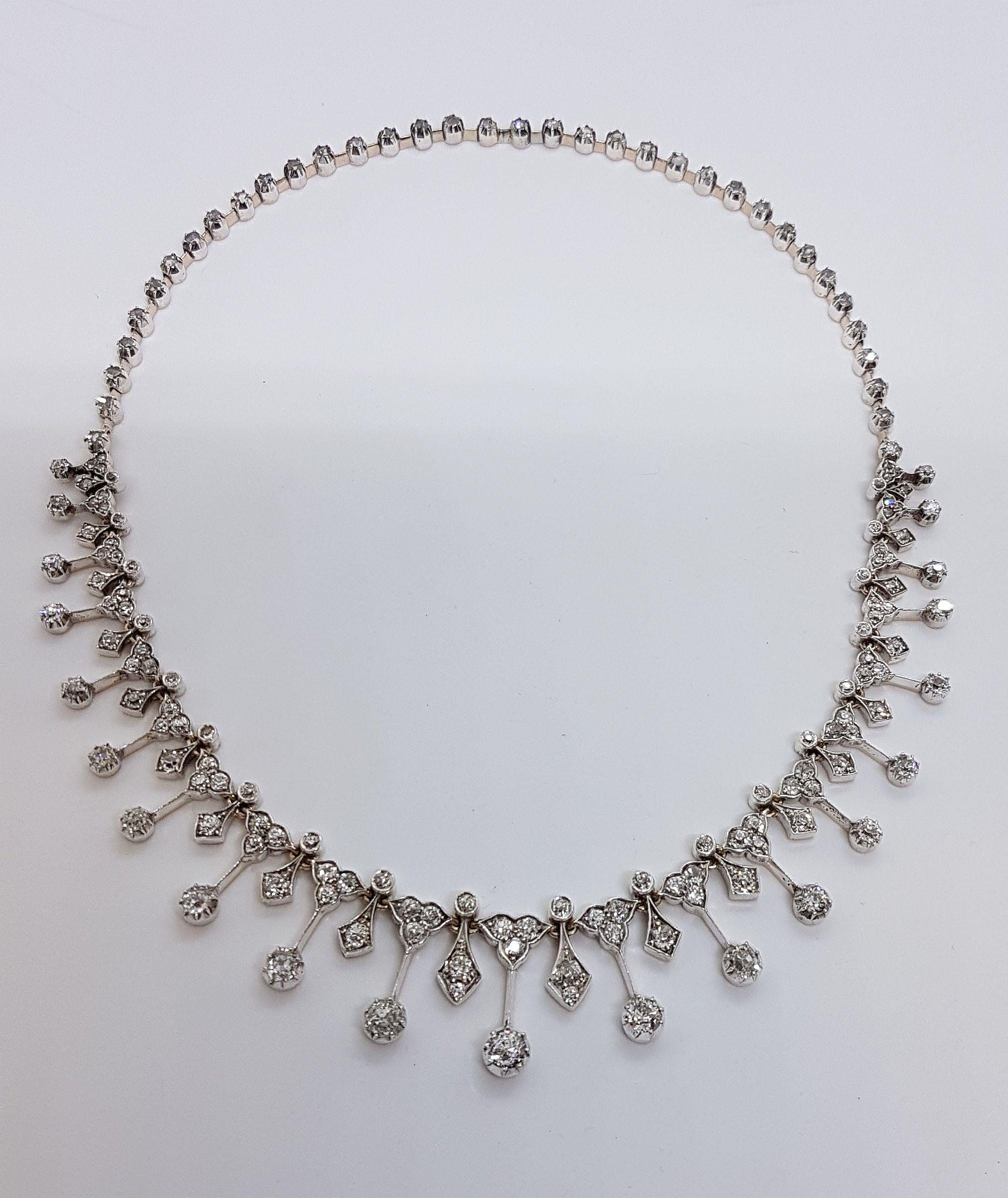 Magnificant tiara made of white gold with different size old european cut diamonds, totaling 8.56 carats.
Brook & Son Edinburgh, Jeweller to the Queen
The tiara can be taken apart and with an extension assembled to an elegant collier.
Very good
