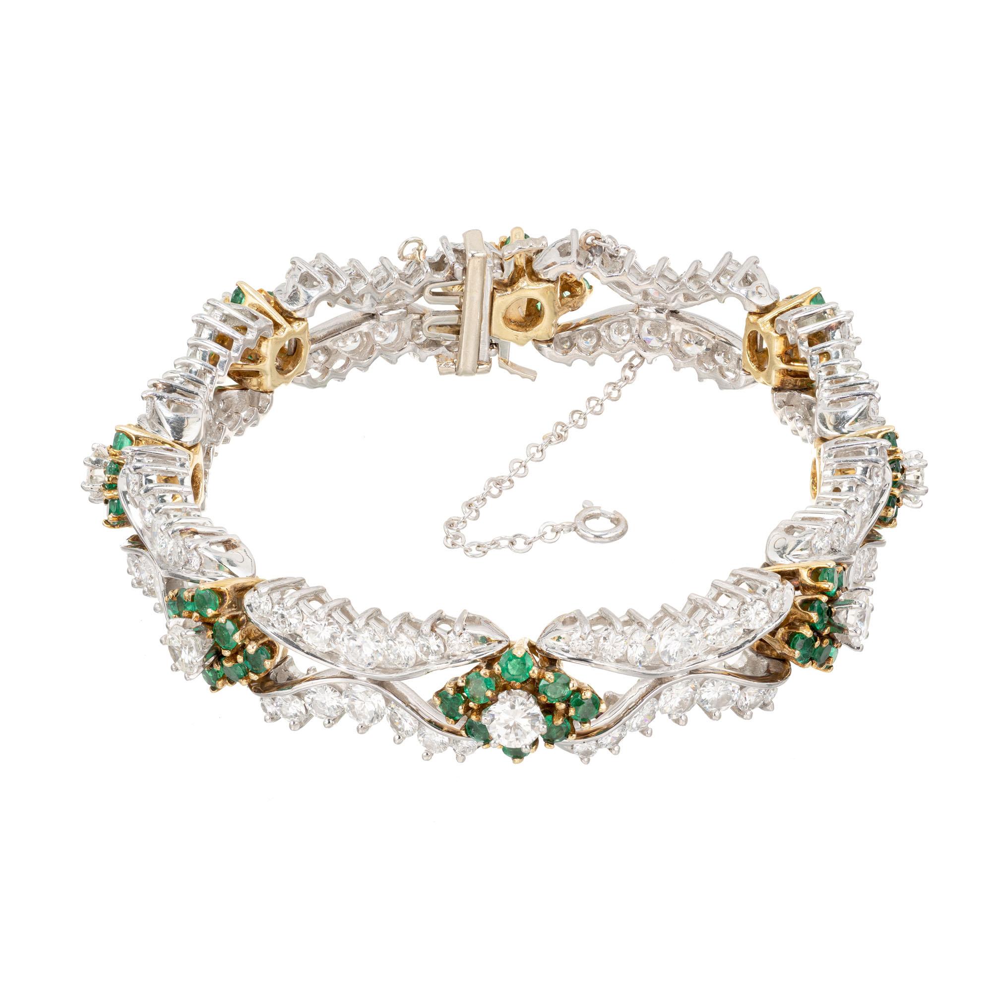 Emerald and diamond hinged link bracelet with built in catch, underside safety catch and chain. Circa 1950's. 14k White and yellow gold. 

8 full cut diamonds, approx. total weight 2.00cts, F, VS
112 full cut diamonds, .03ct to .16ct each, approx.